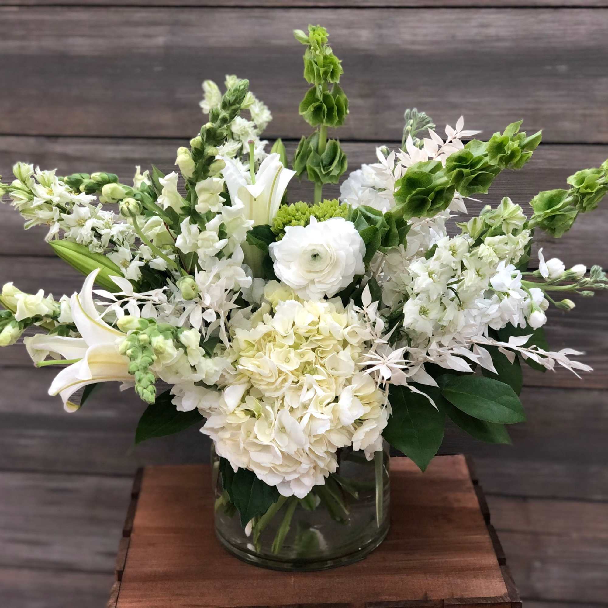 White floral arrangement in a glass vase