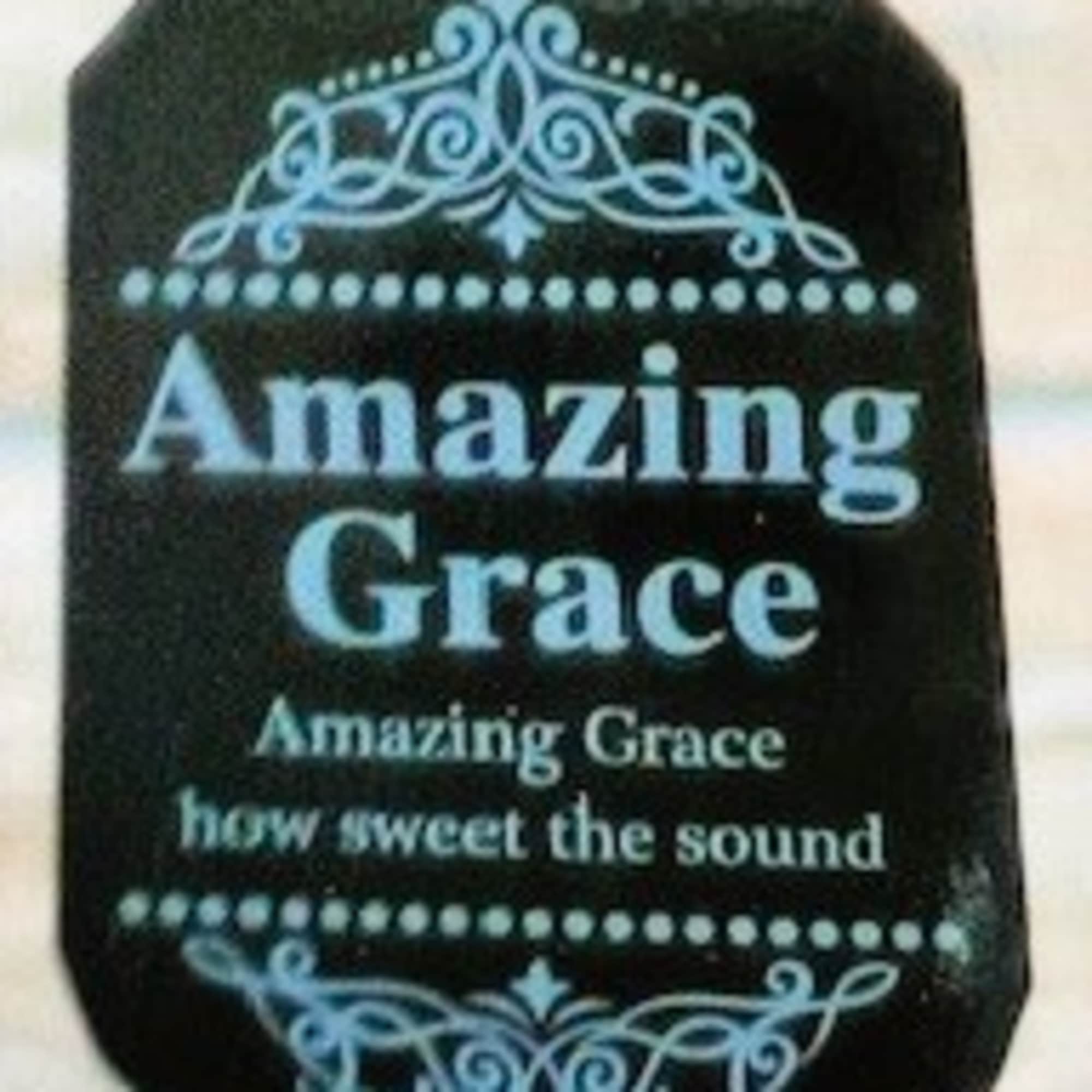 Black plaque with blue text reading Amazing Grace