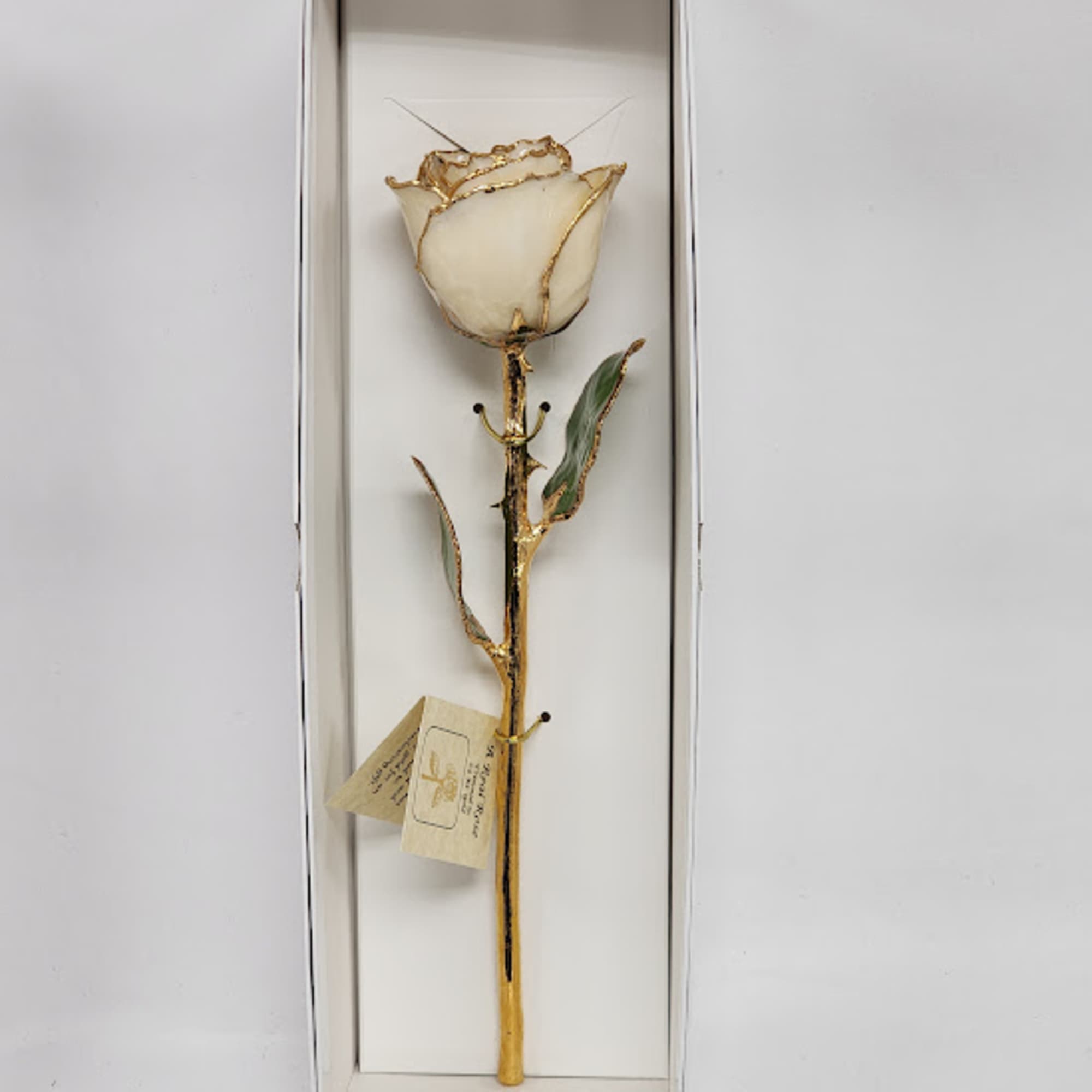 A real rose preserved to last and then trimmed with real 24kt