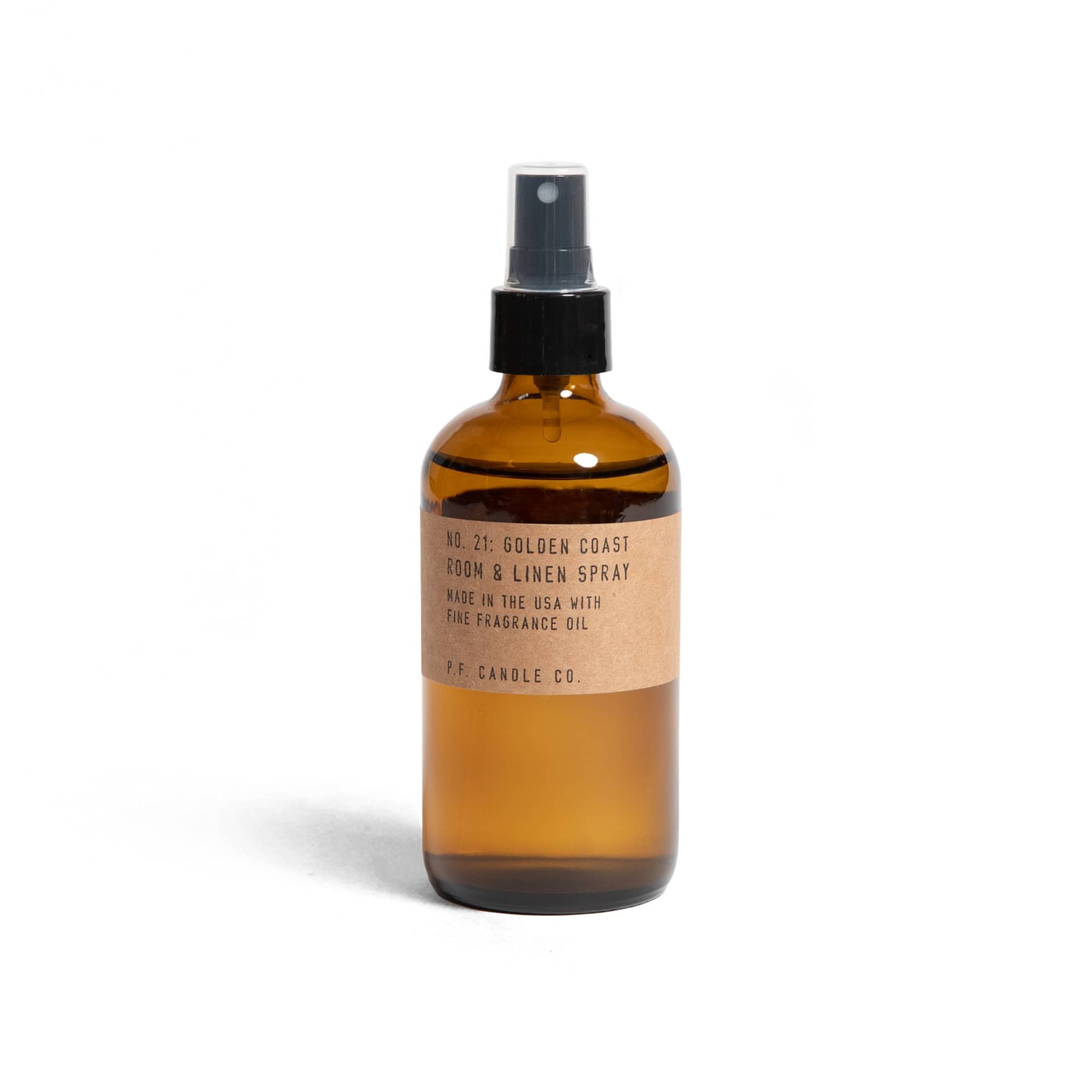Amber room spray bottle with black pump and kraft label