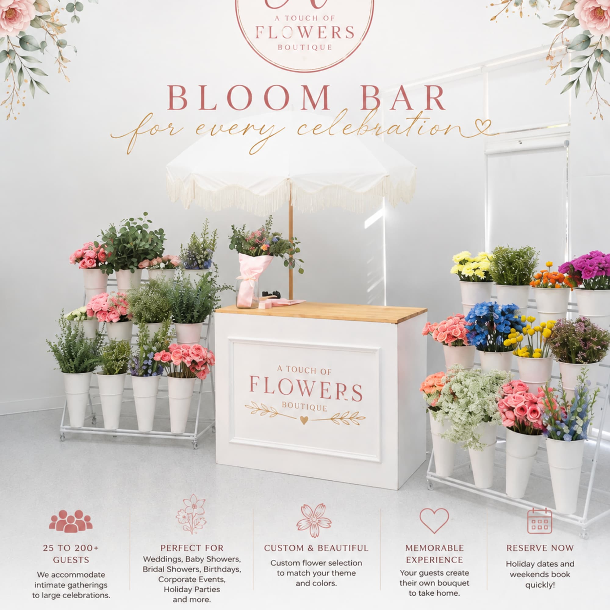 Bloom bar display with assorted flowers in white buckets under a canopy