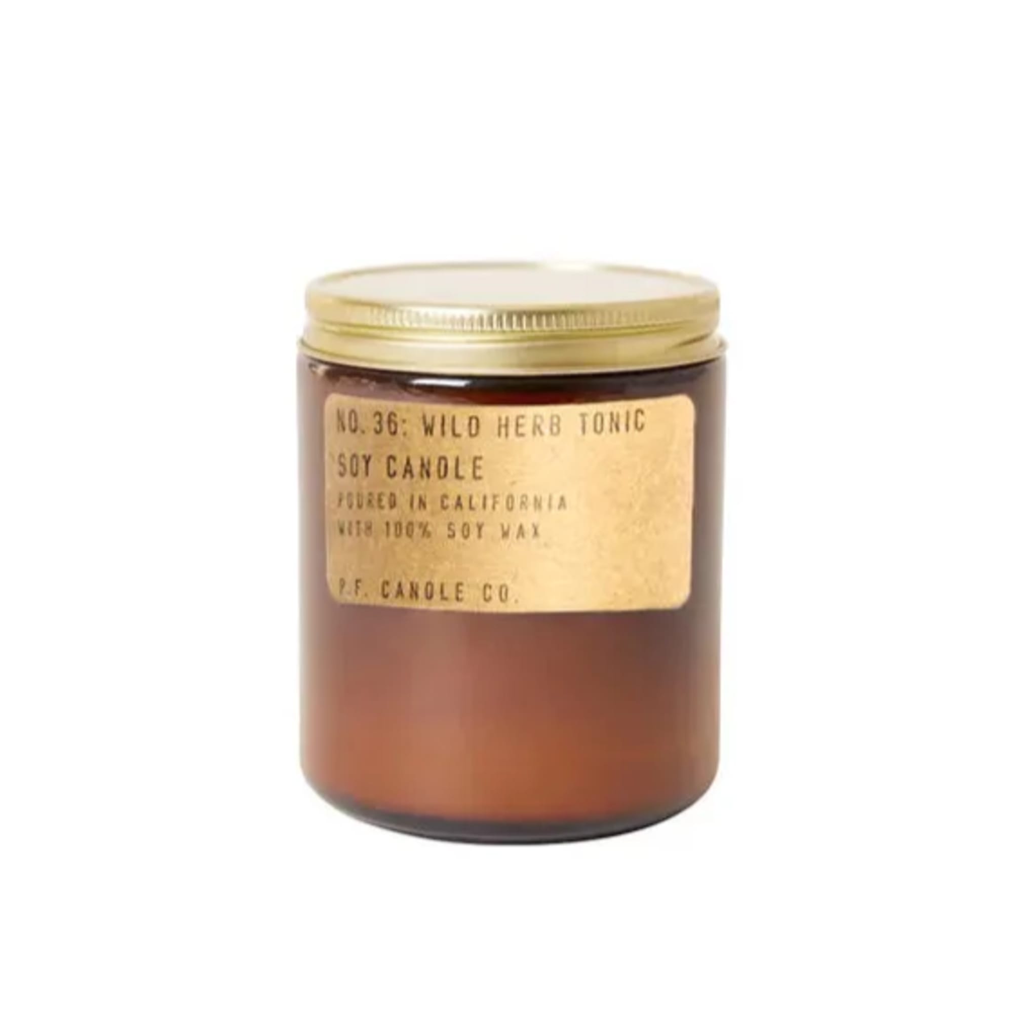 Amber jar candle with a gold lid and label