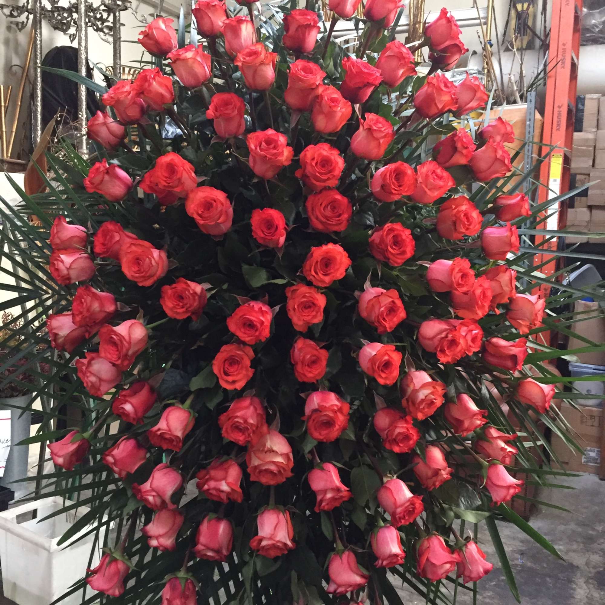 Large standing spray of red and pink roses