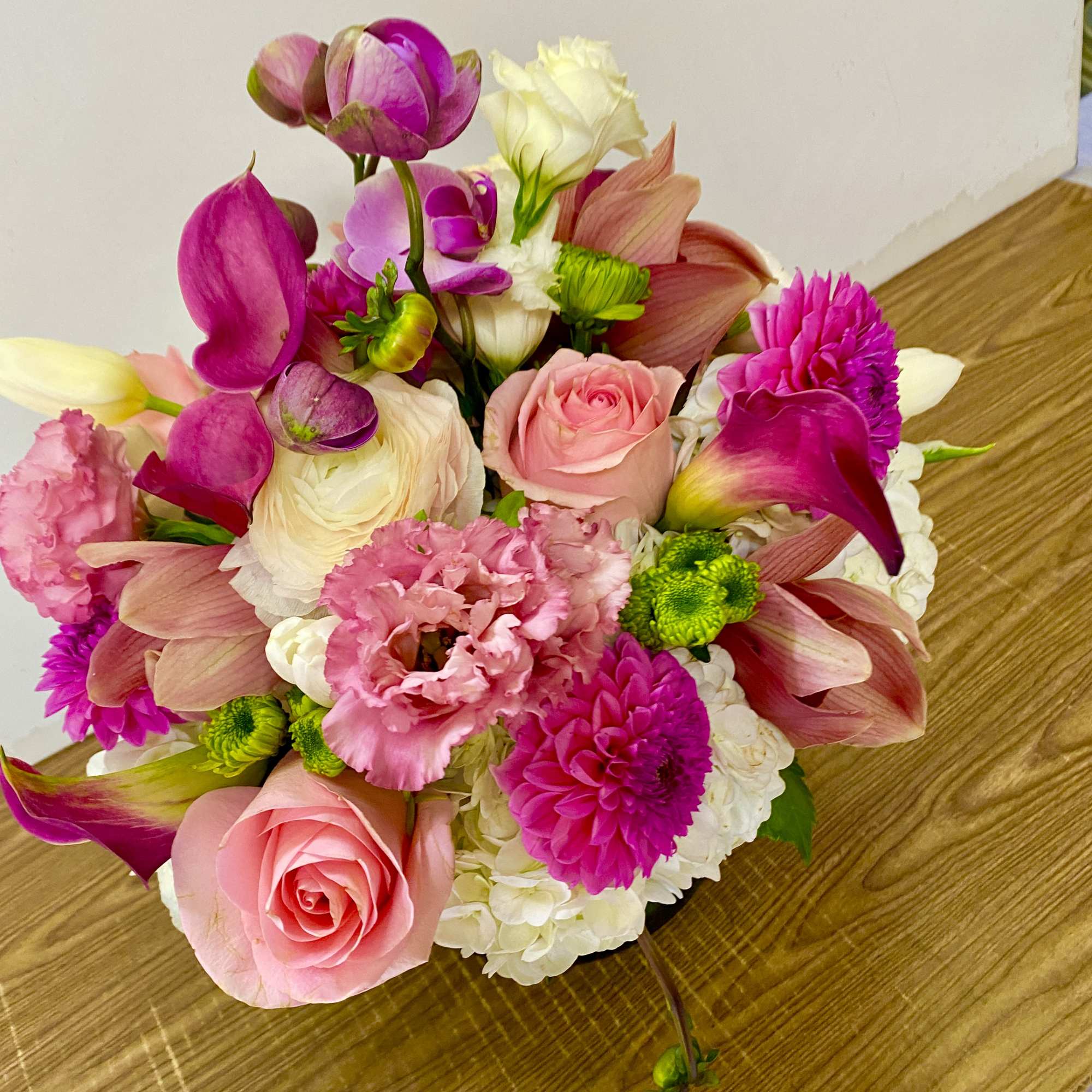 Pink and white mixed bouquet with roses, calla lilies, and chrysanthemums