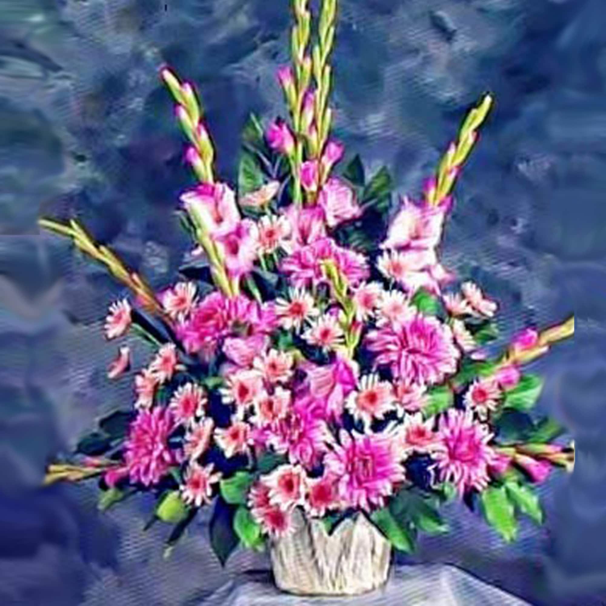 Tall pink floral arrangement with daisy blooms and spikes in a white basket container