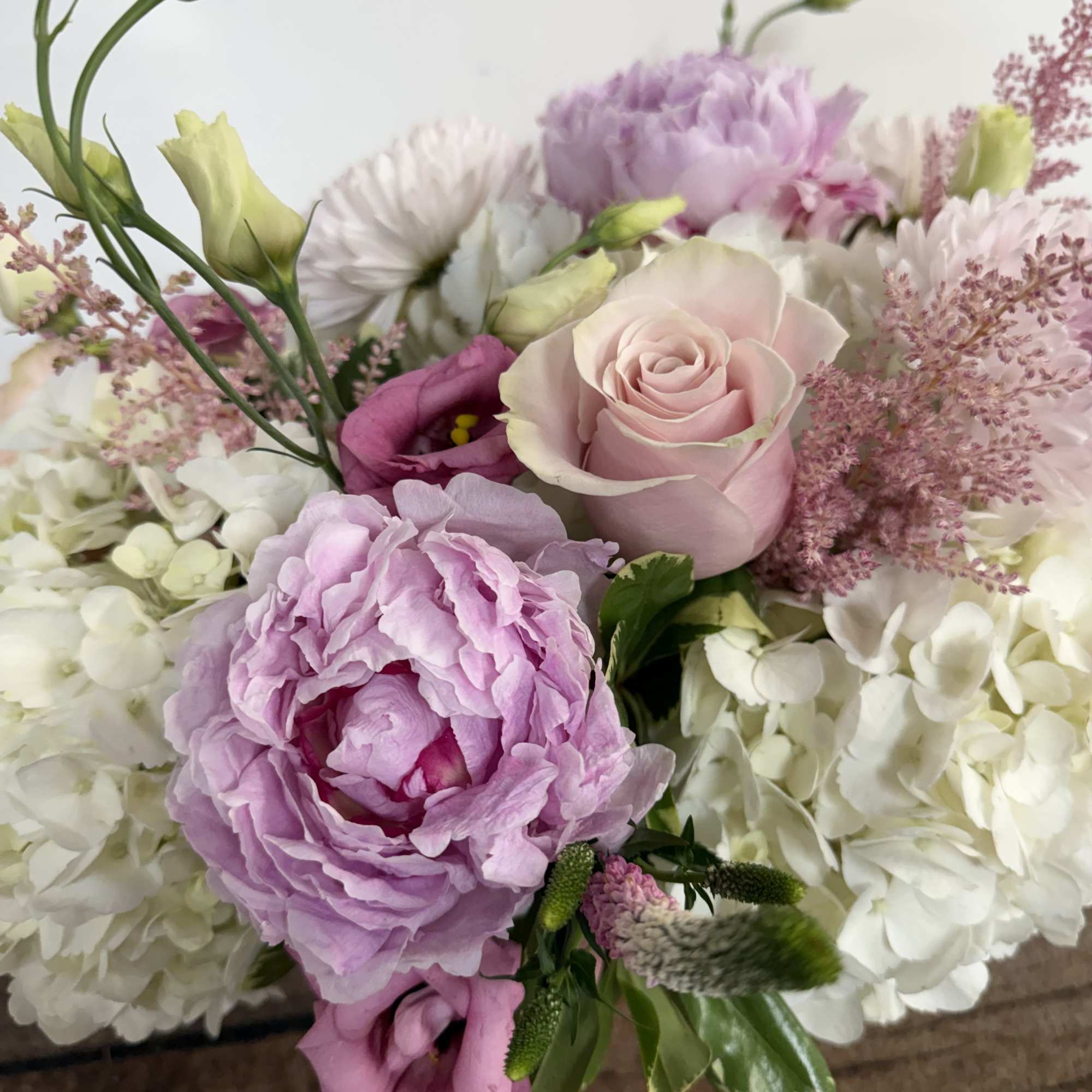 Blush pink blooms beautifully designed in a pink ceramic, textured container. Approx., photo 2 of 2