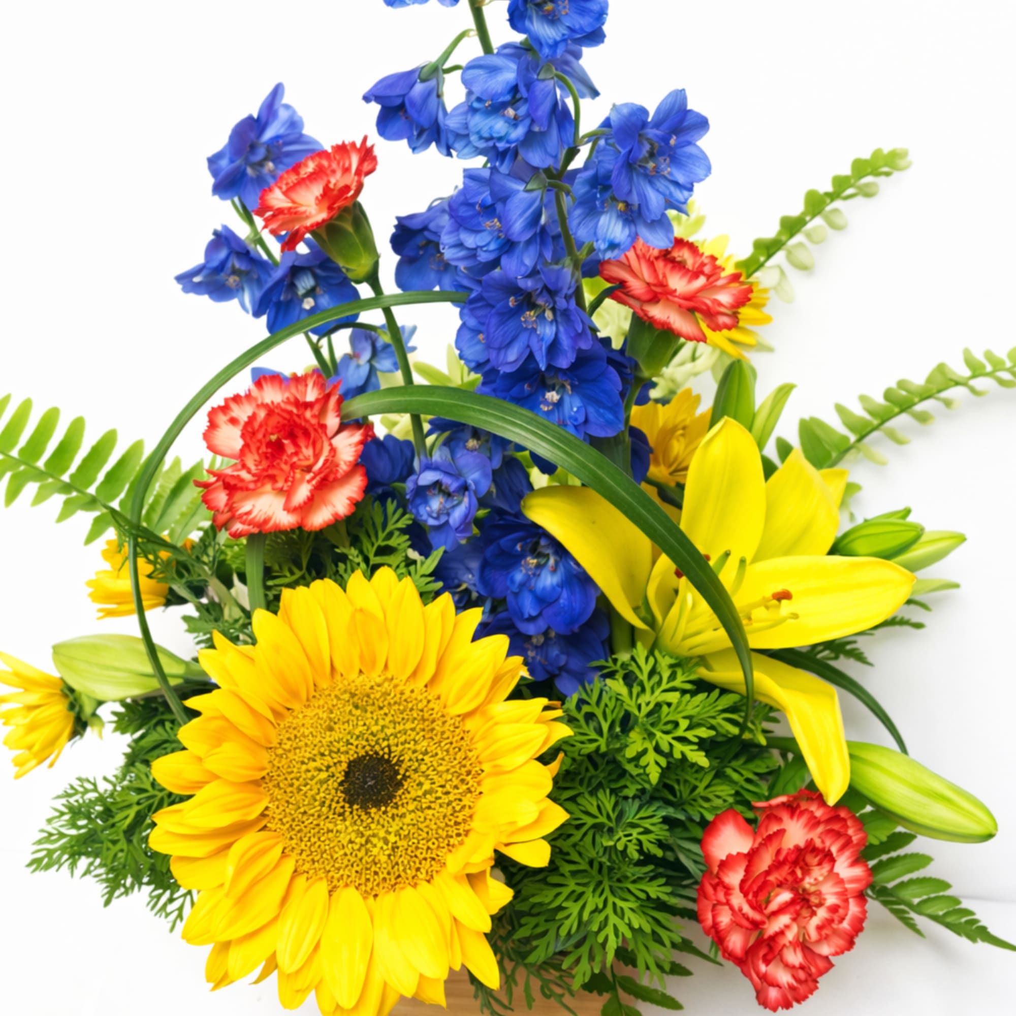 Bouquet with yellow lilies, blue delphinium, and red carnations