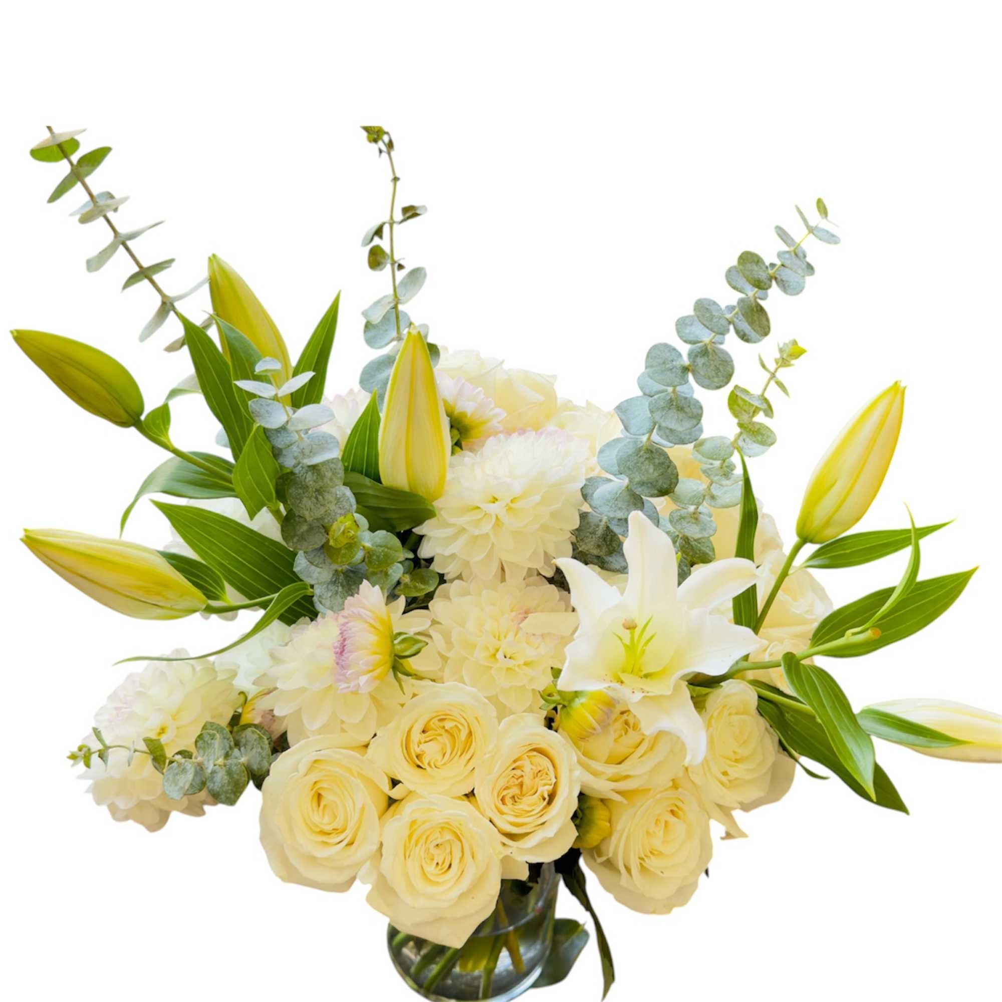 Cream roses and white lilies in a glass vase with eucalyptus