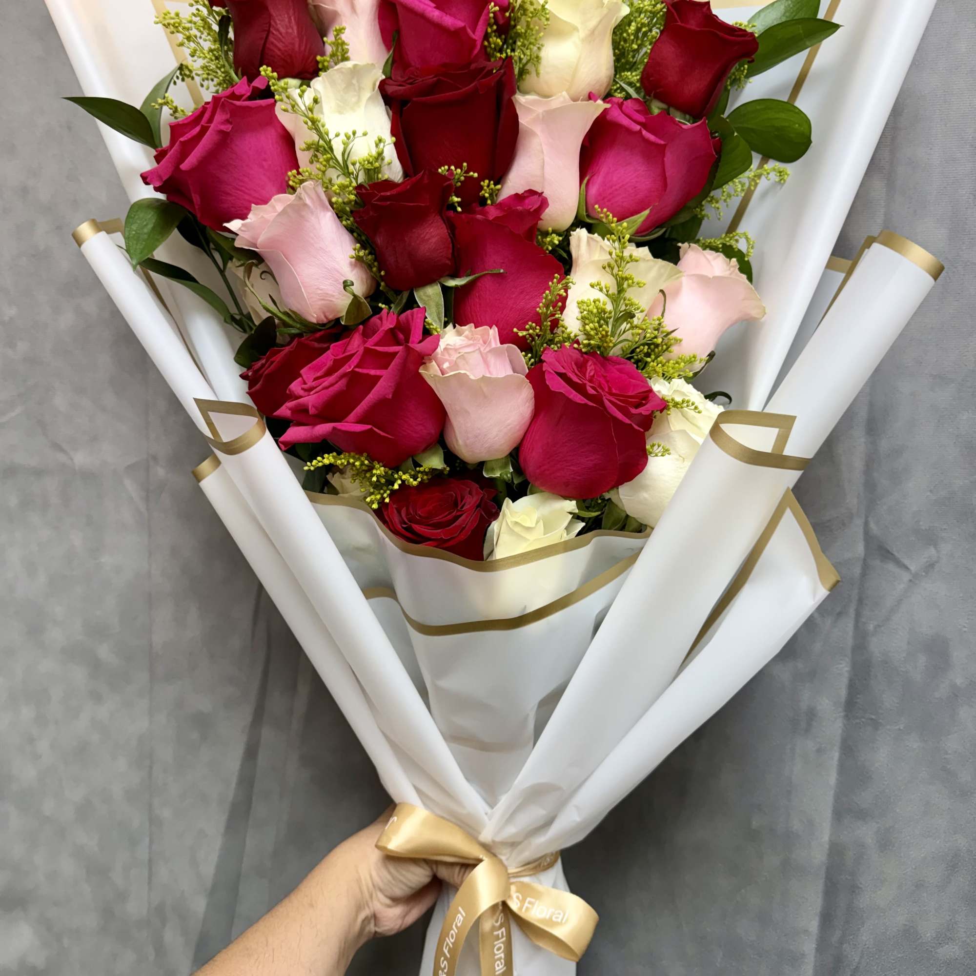 A classic and elegant rose bouquet featuring a beautiful mix of red