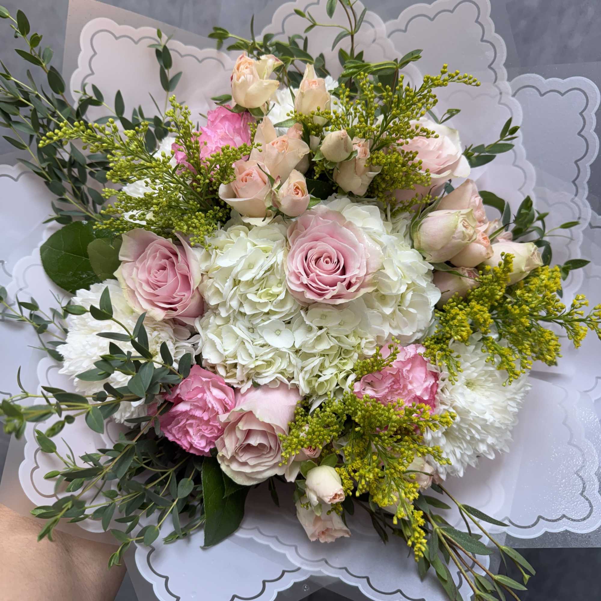 A beautiful bouquet of pink roses &amp; carnations with white hydrangeas 