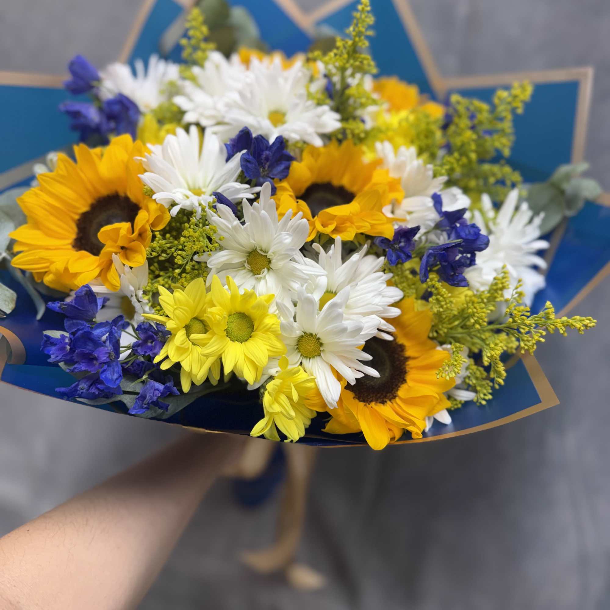 Inspired by Van Gogh, this stunning arrangement features sunflowers, daisies, delphiniums, and, photo 2 of 2