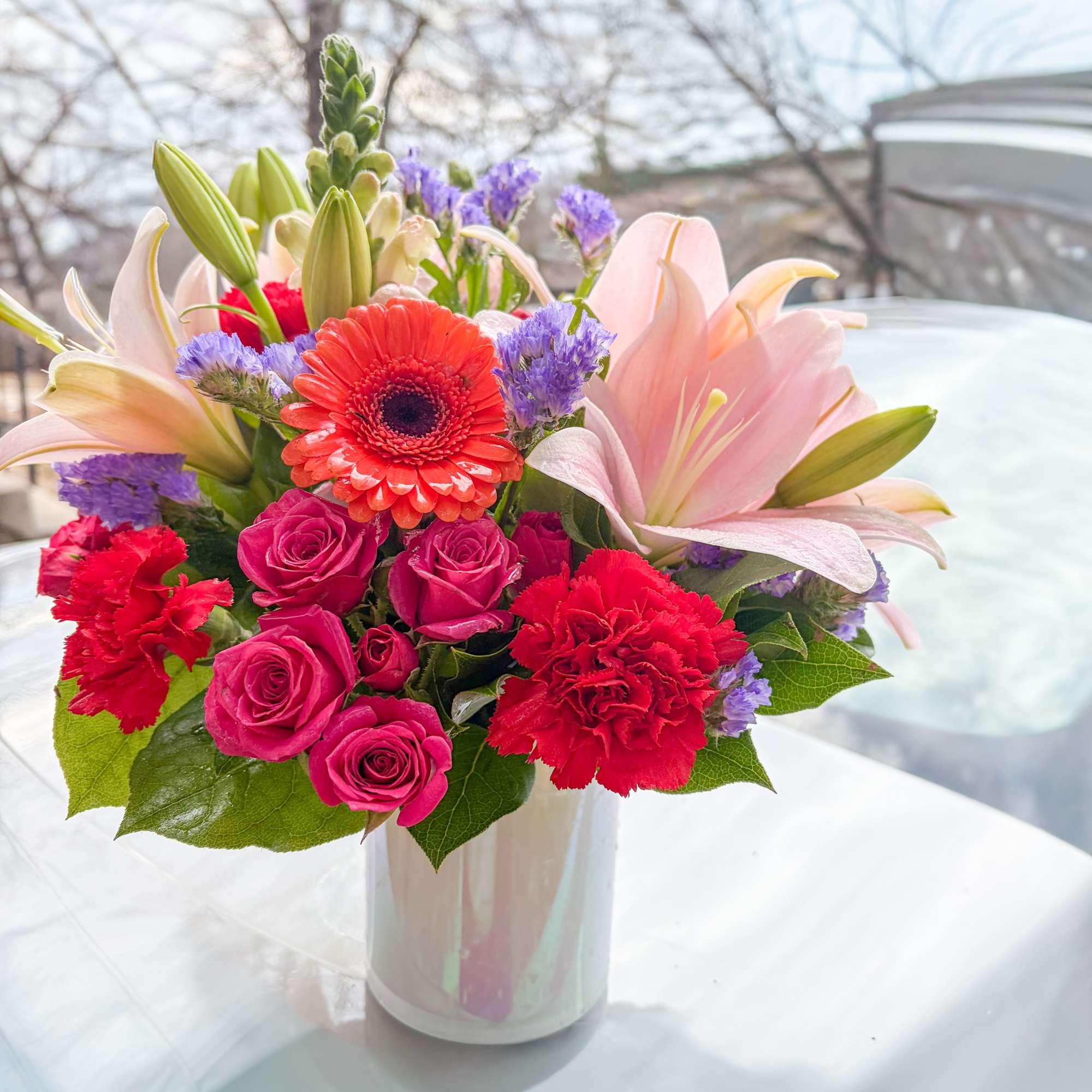 Stunning bouquet with pink Lillies, orange Gerber's, Hot pink spray roses, Hot