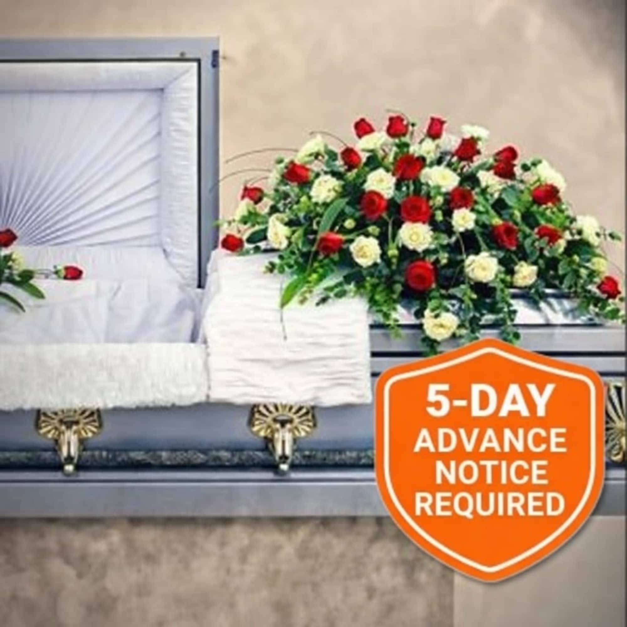 This mixed arrangement casket tribute is a celebration of a life lived