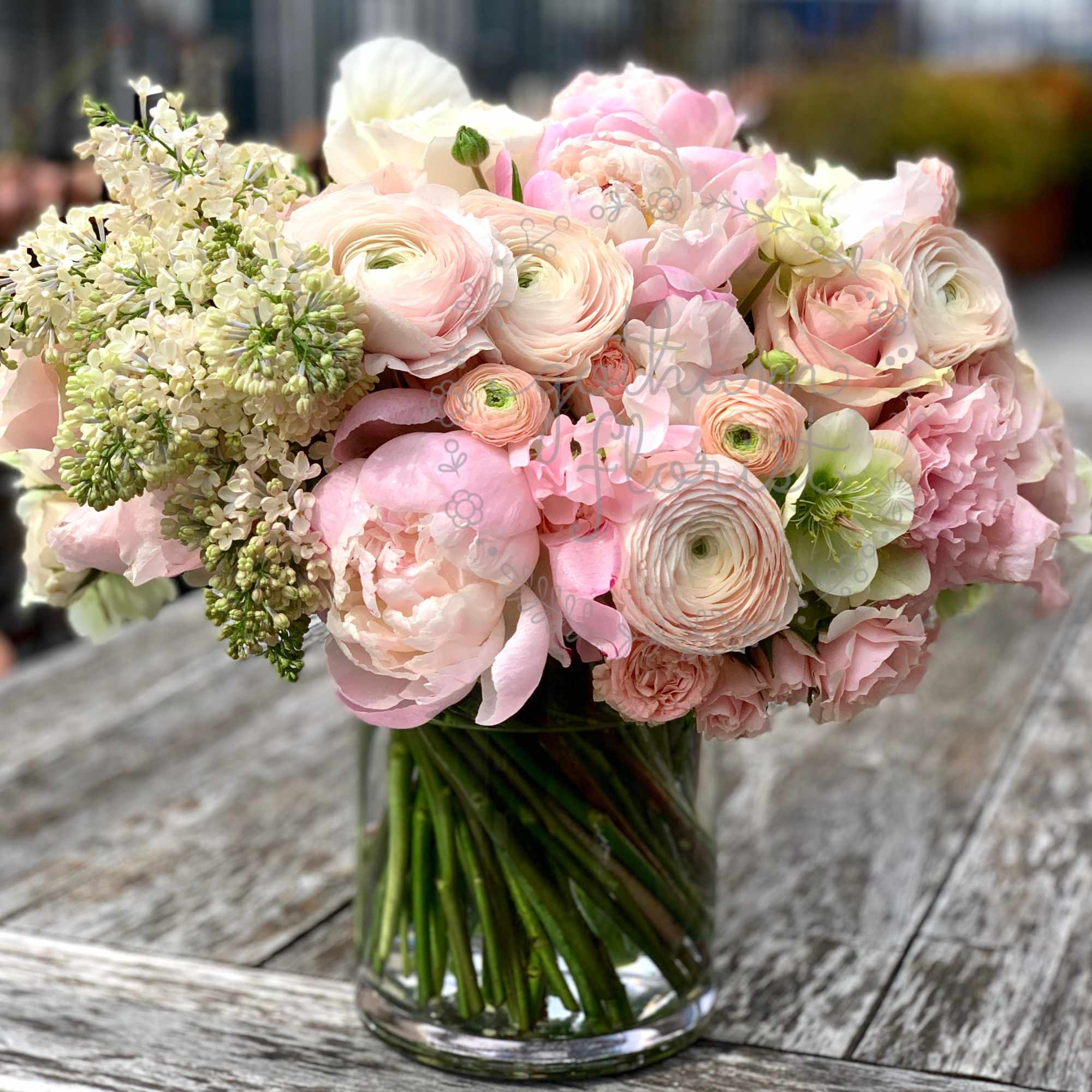 Soft pink roses with creamy white roses, elegant ranunculus, sweet pea and, photo 2 of 2