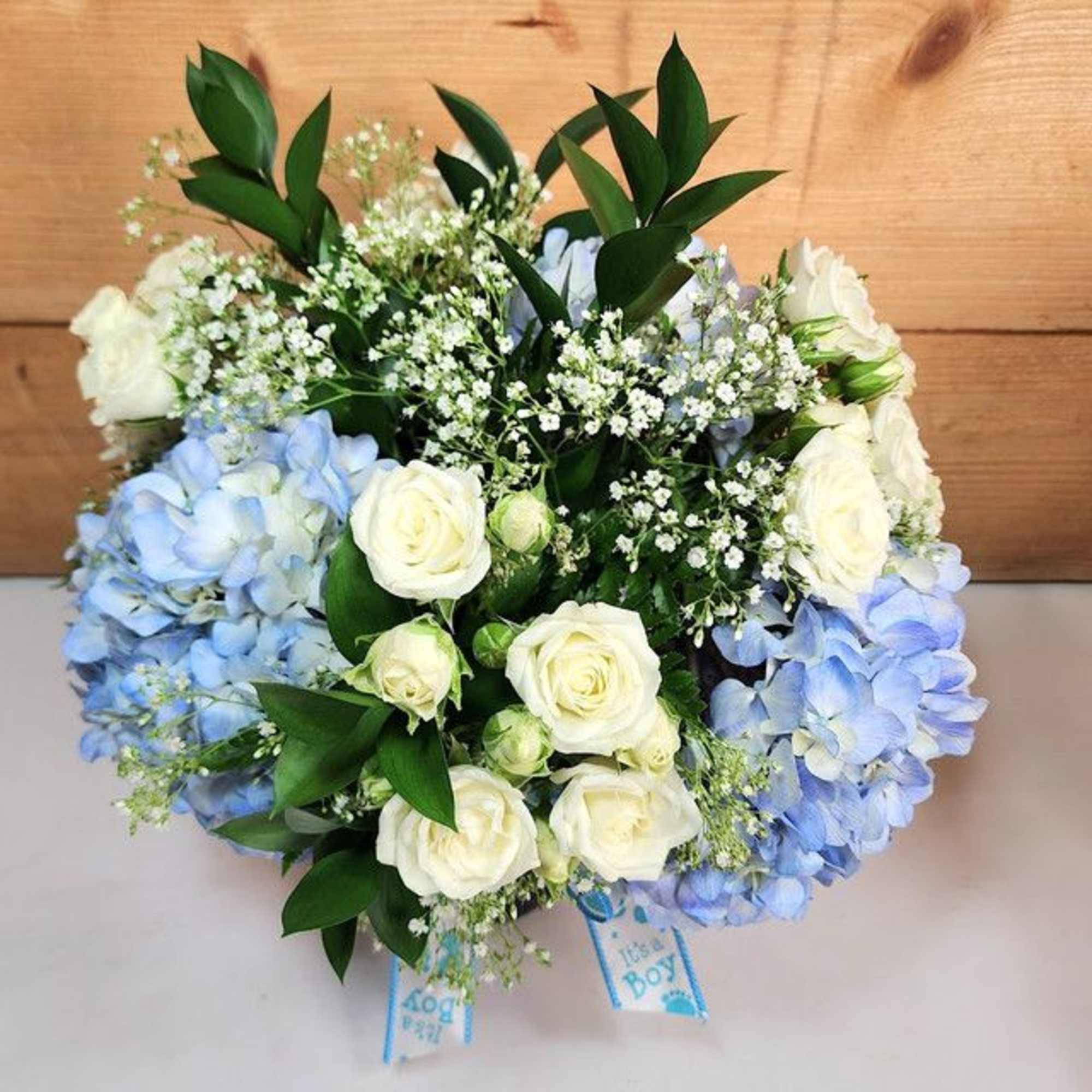 Blue and white floral bouquet with roses and hydrangeas