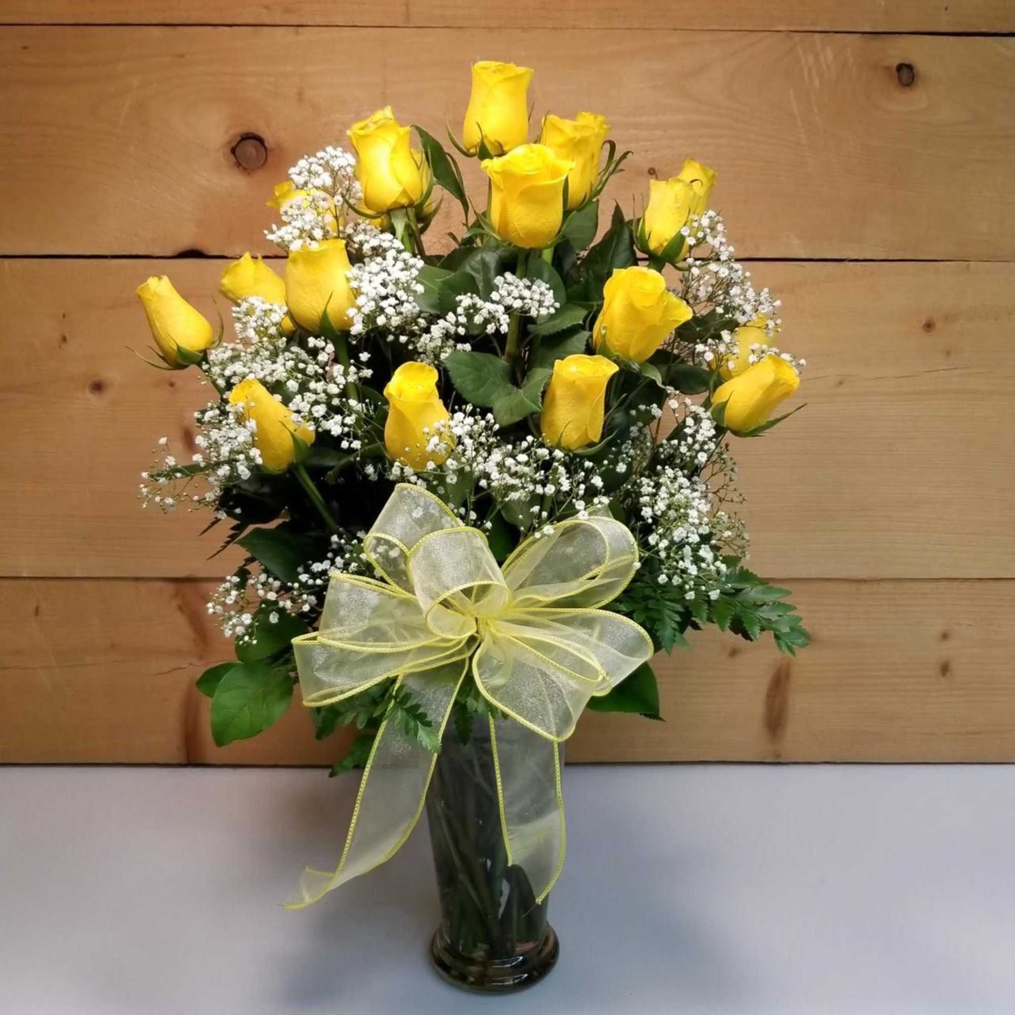 Two Dozen Yellow Roses featuring 24 Long-stemmed yellow roses elegantly displayed in