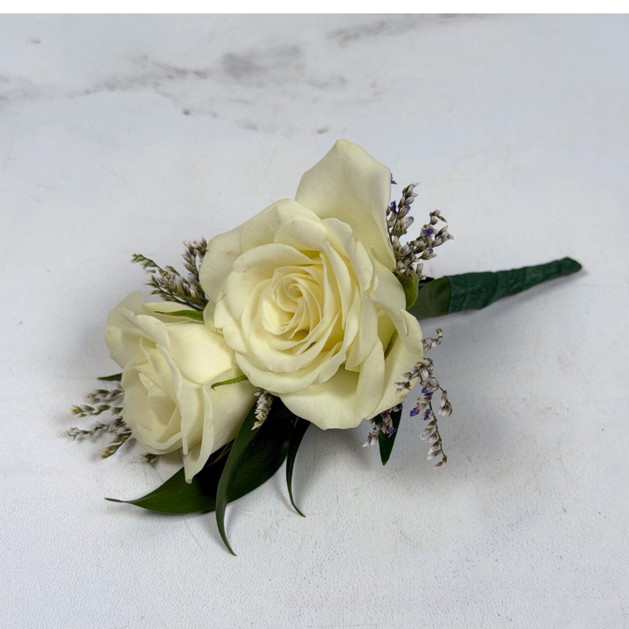 Two ivory-white spray roses are clustered tightly together in this white spray, photo 2 of 3