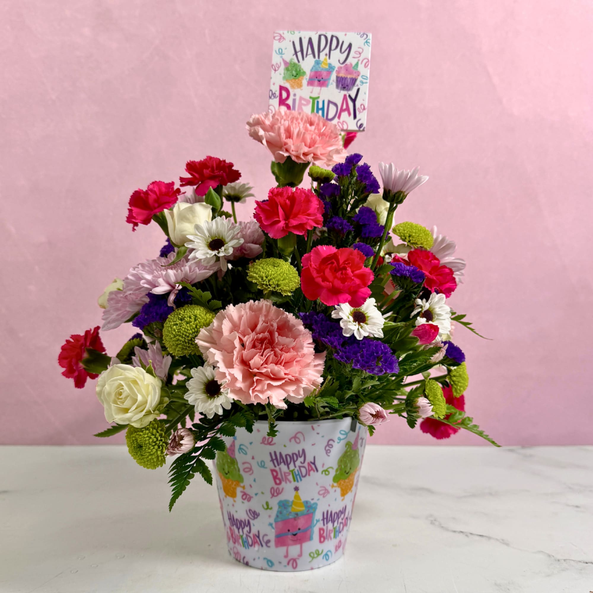 Mixed bouquet in a birthday-themed pot with a Happy Birthday sign