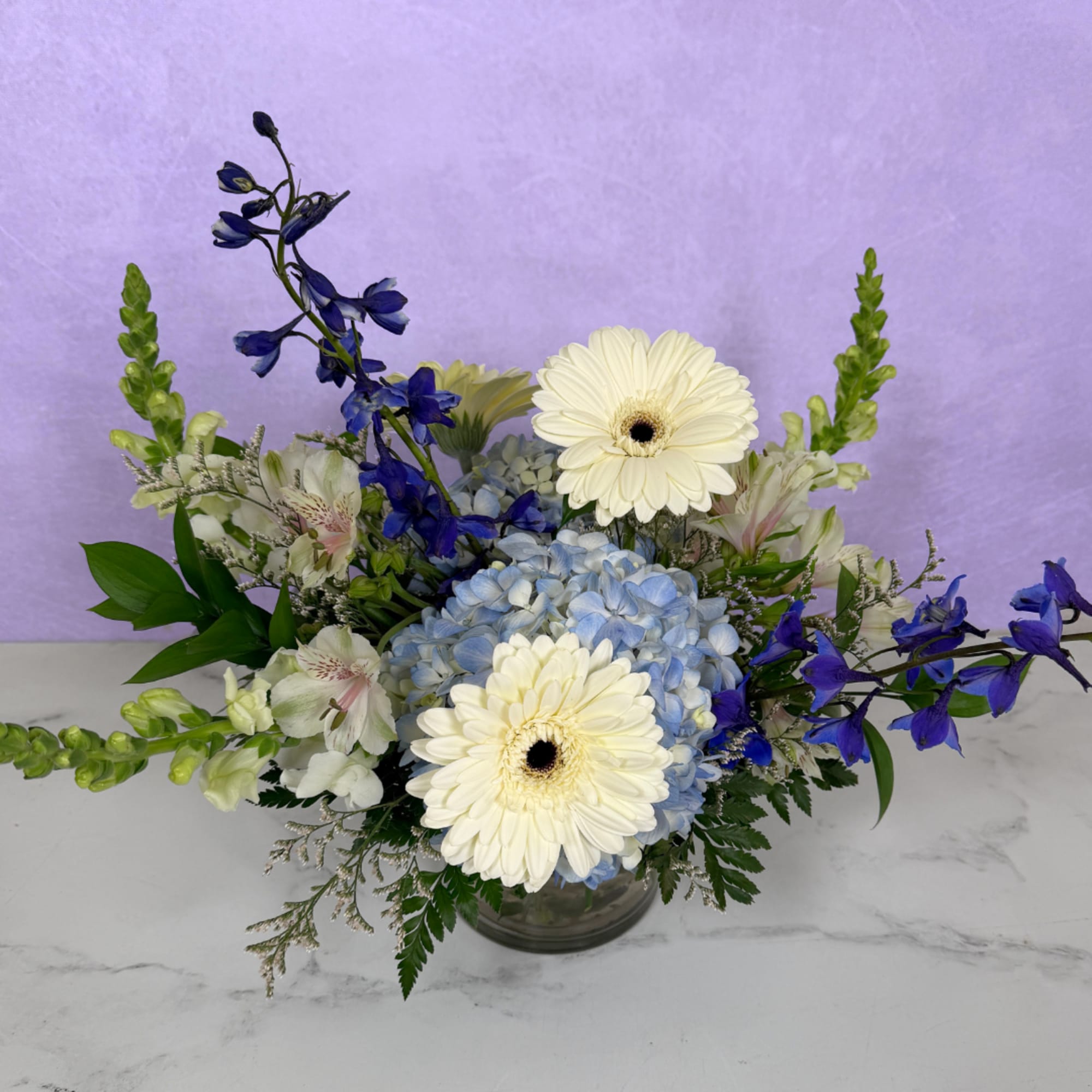 Whispering Winds Cylinder by Savilles Florist is a stunning display of blue, photo 3 of 3