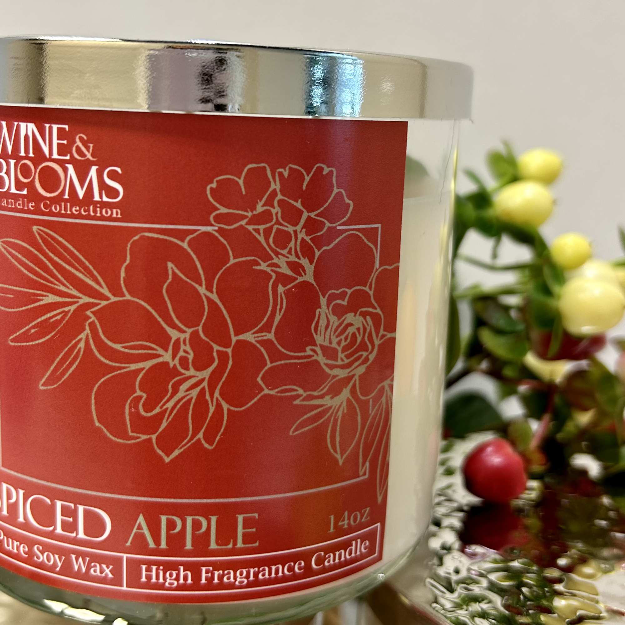 Spiced Apple candle in a glass jar with a silver lid