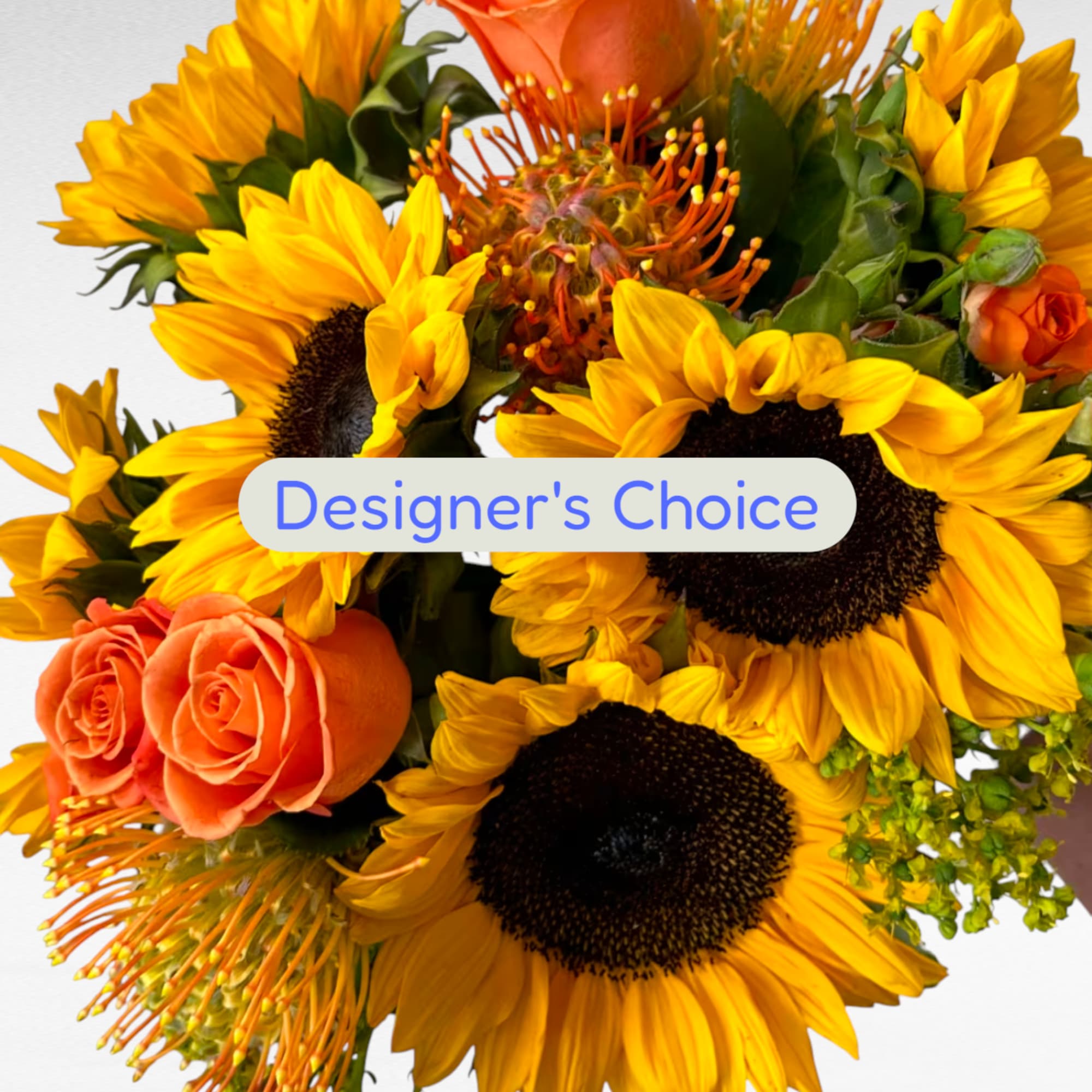 Bouquet of sunflowers and orange roses with a Designer's Choice label