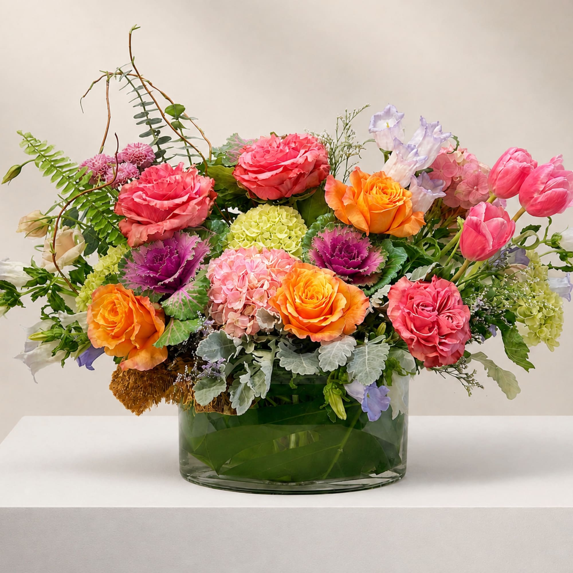Colorful mixed flower arrangement in a glass vase