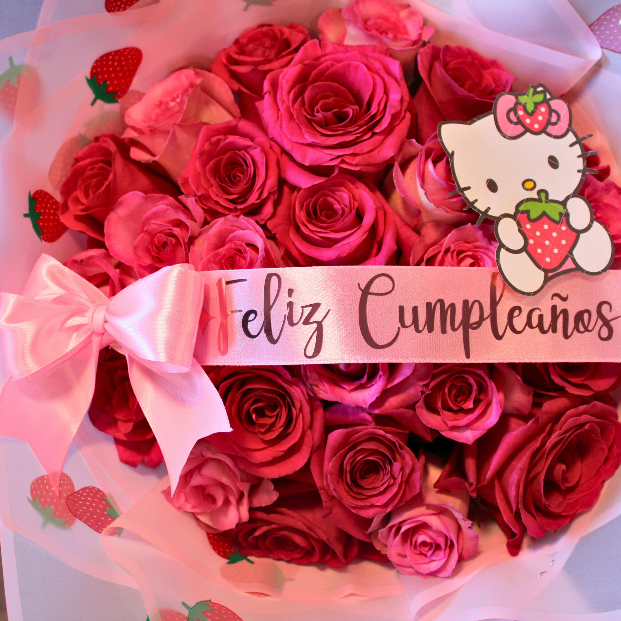 Bouquet of pink and red roses with a Hello Kitty birthday ribbon