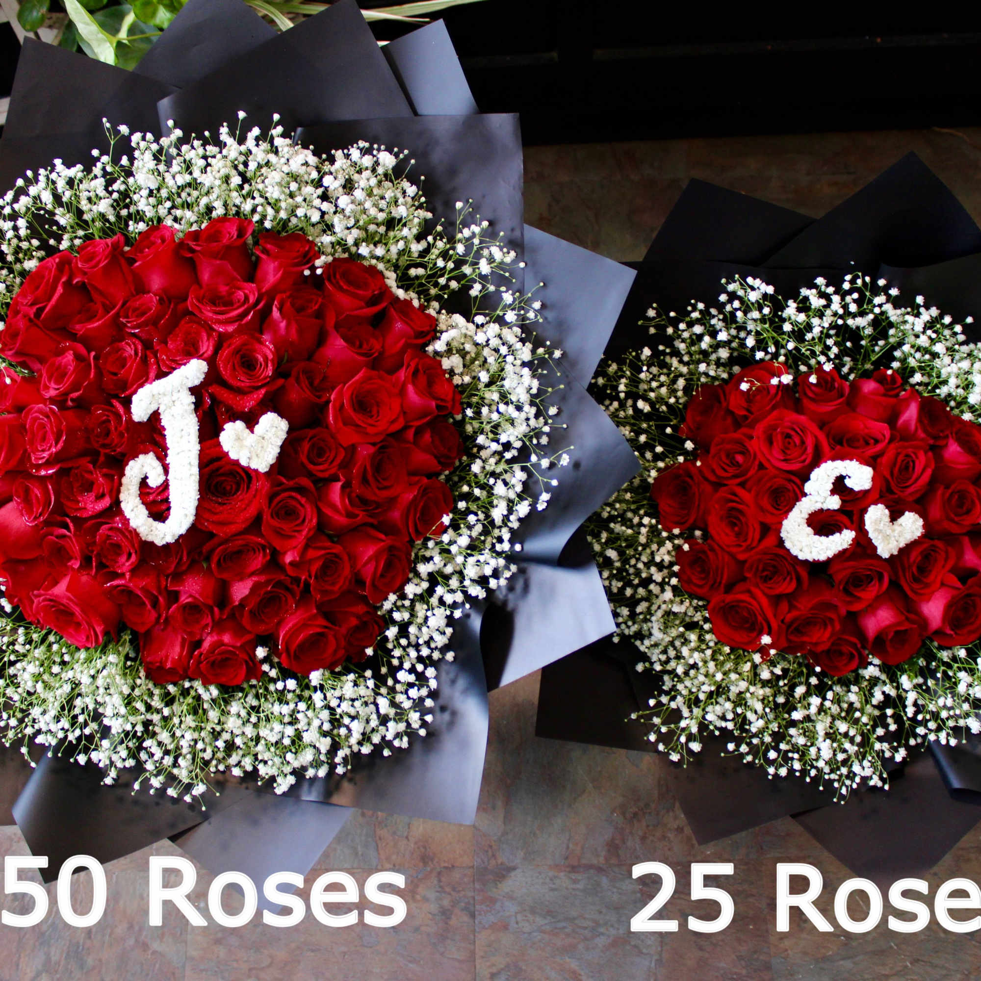Two red rose bouquets with baby's breath and black wrapping, labeled 50 Roses and 25 Roses.