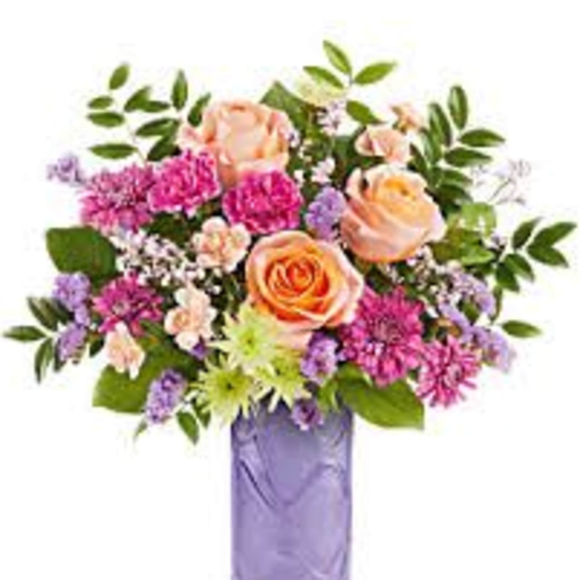 mix of greens, pinks and peach in a lovely keepsake lavender vase