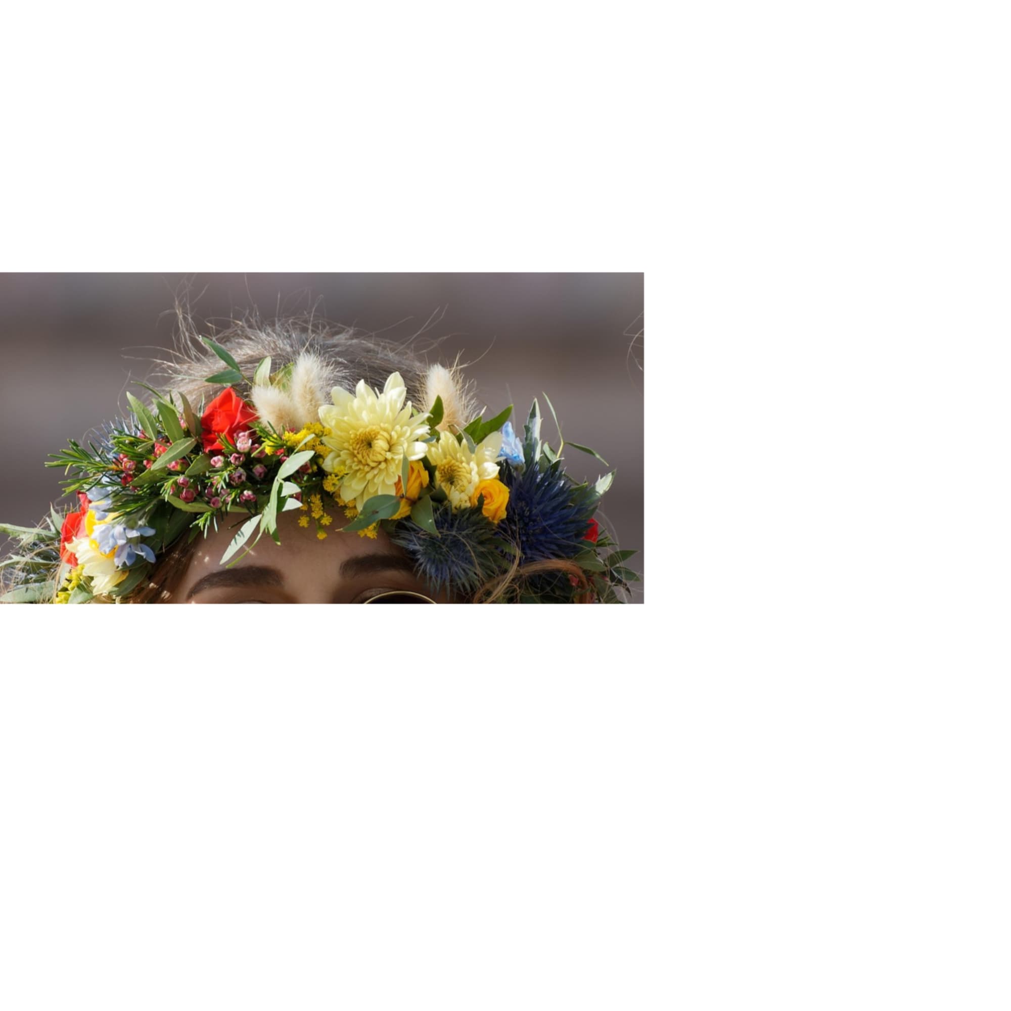 Flower crown with mixed blooms in red, yellow, white, and blue
