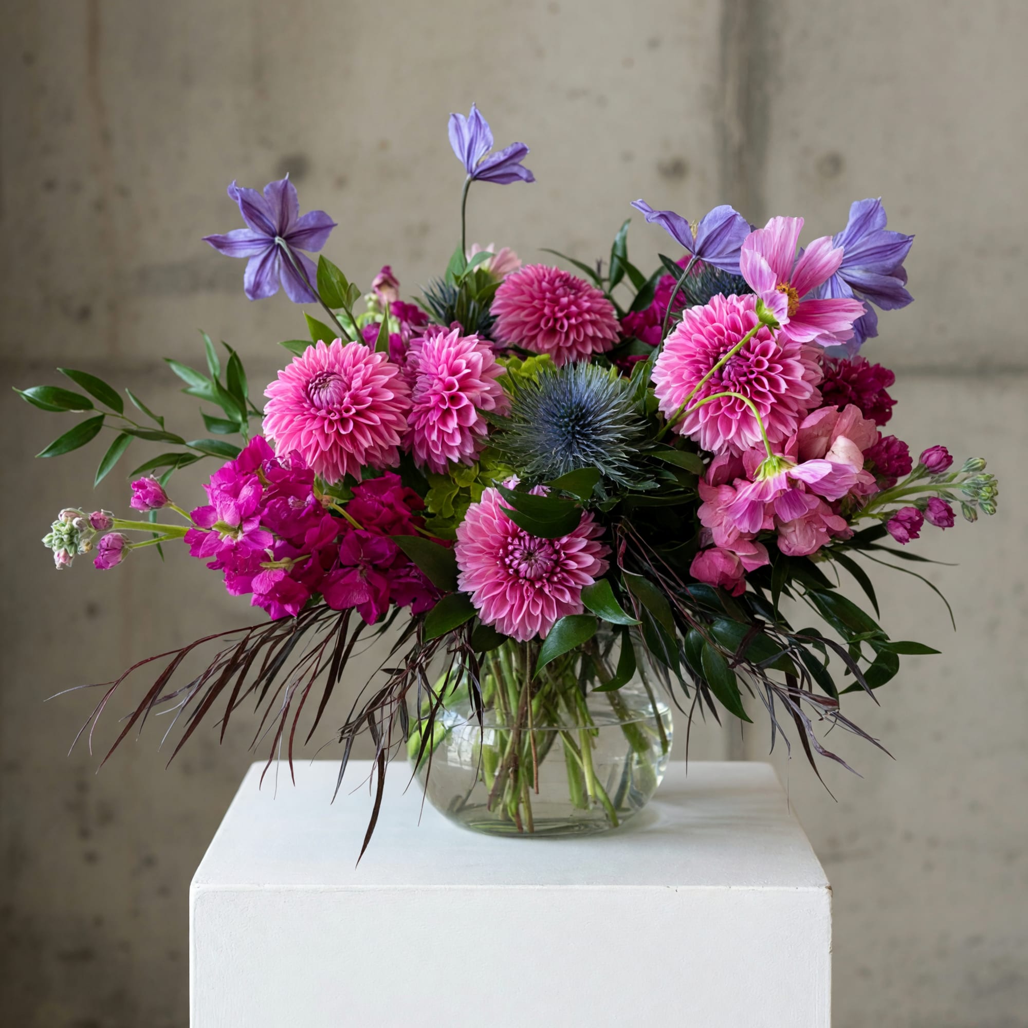 Pink and purple mixed bouquet in a clear glass vase, photo 2 of 2