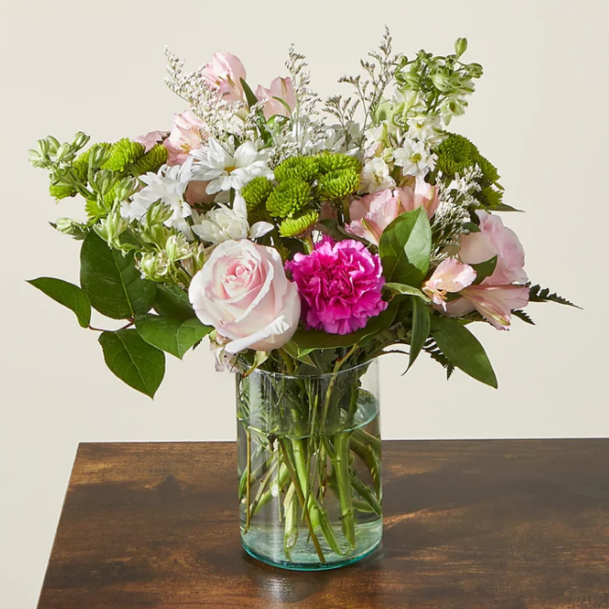 Pink and white mixed bouquet in a clear glass vase