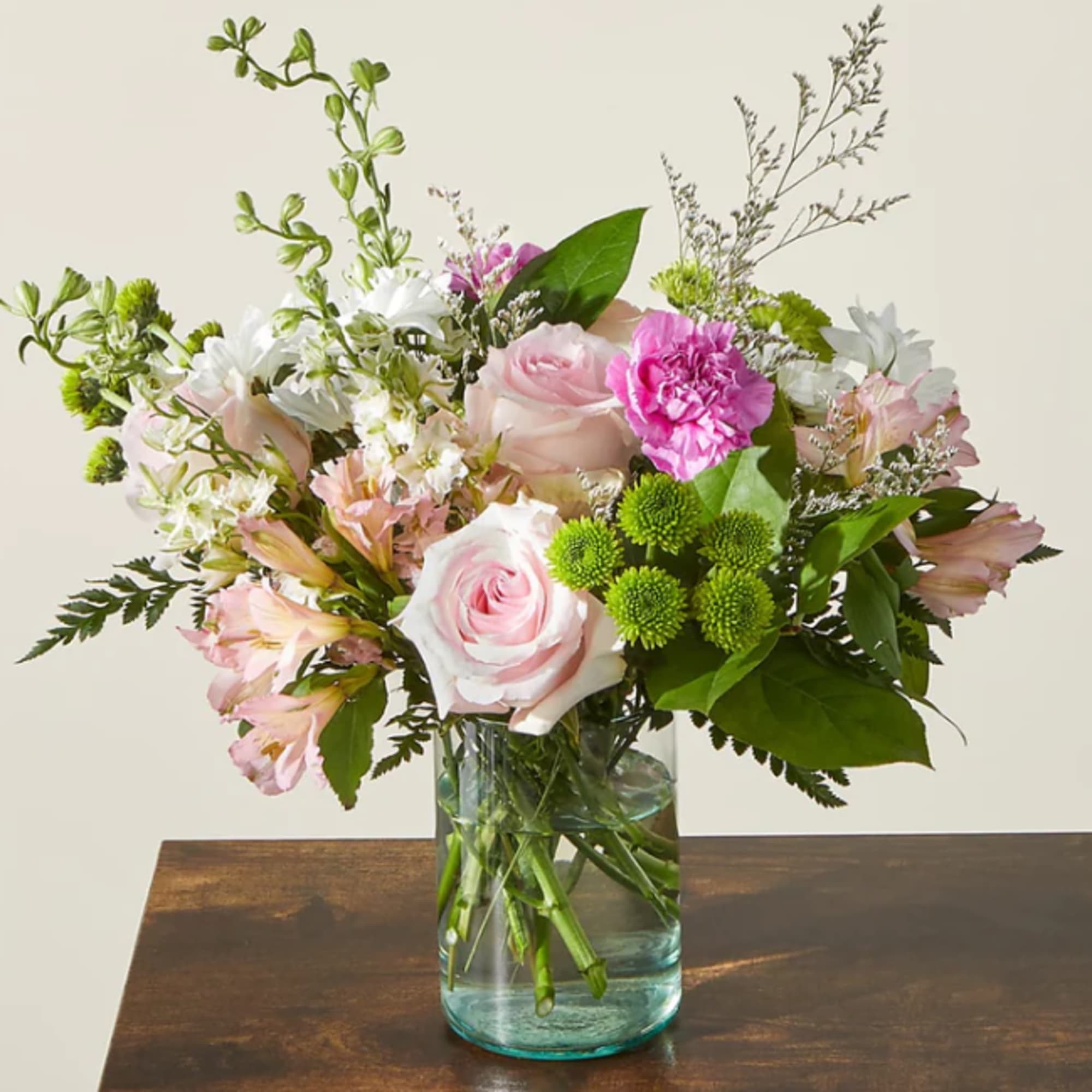 Pink and white bouquet in a clear glass vase