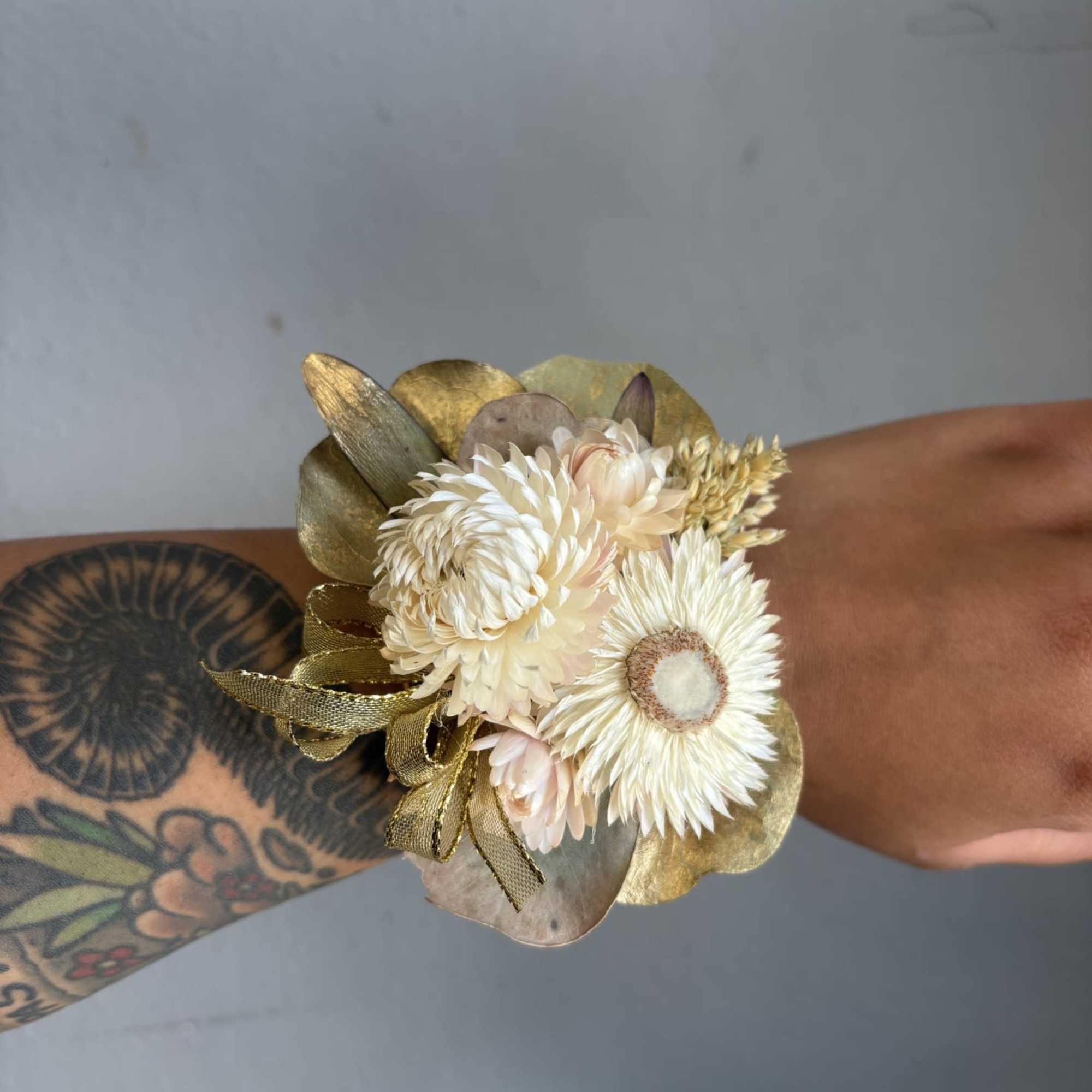 A beautiful wrist corsage designed with dried flowers., photo 2 of 3