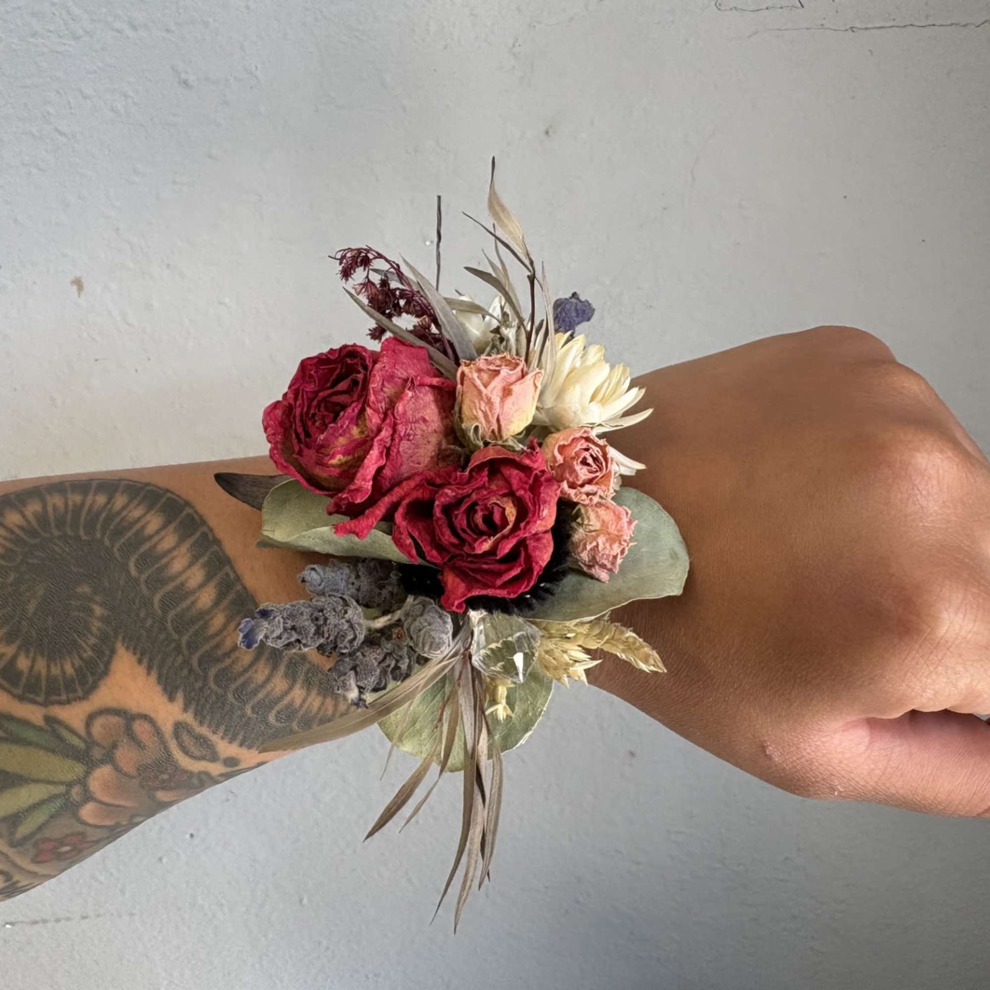 A beautifully designed wrist corsage made to last. Gorgeous dried flowers accented