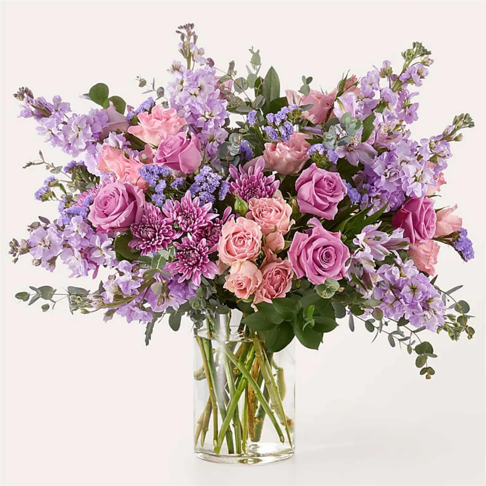 Pink and lavender bouquet in a clear glass vase