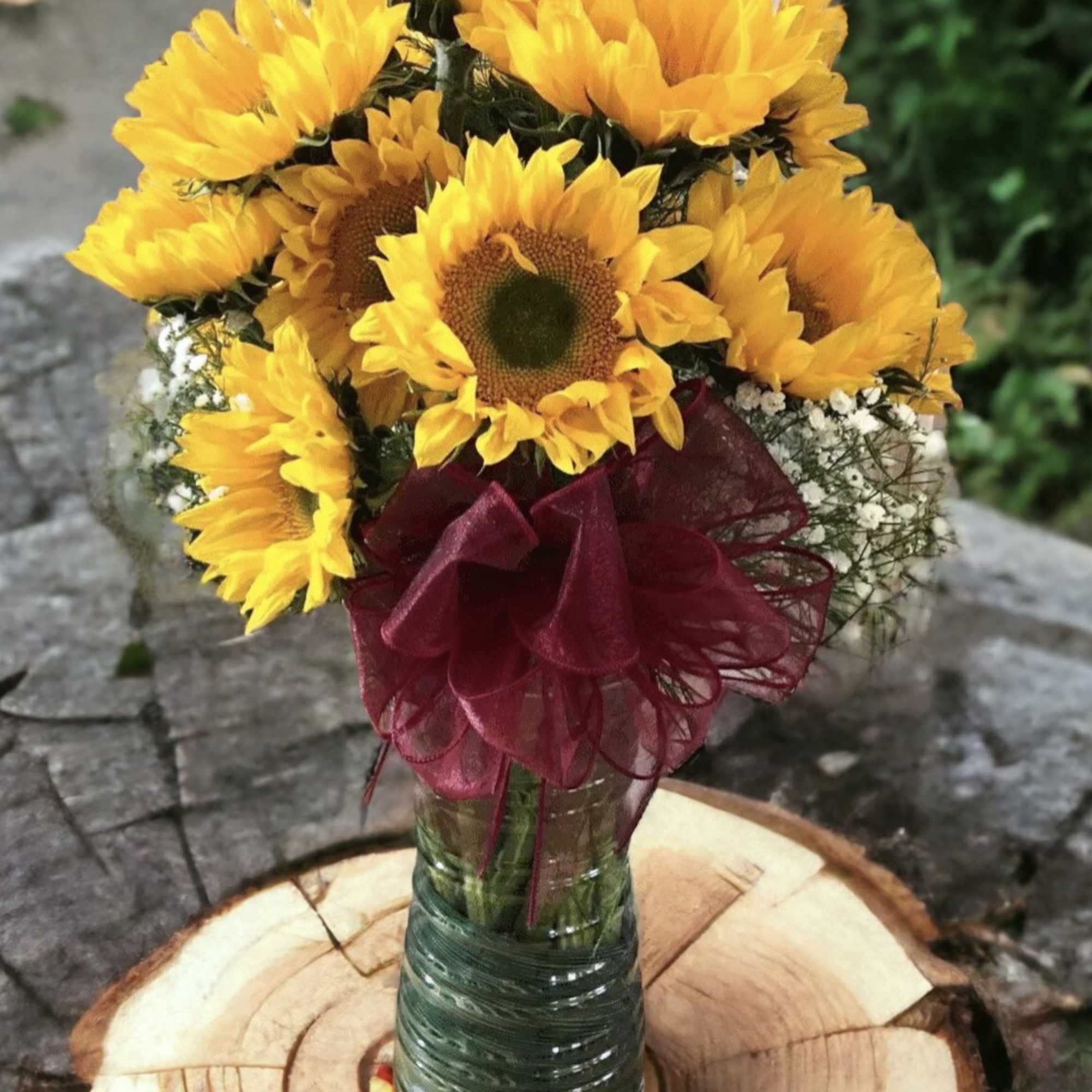 Brighten someone's day with a stunning arrangement featuring a large, clear glass