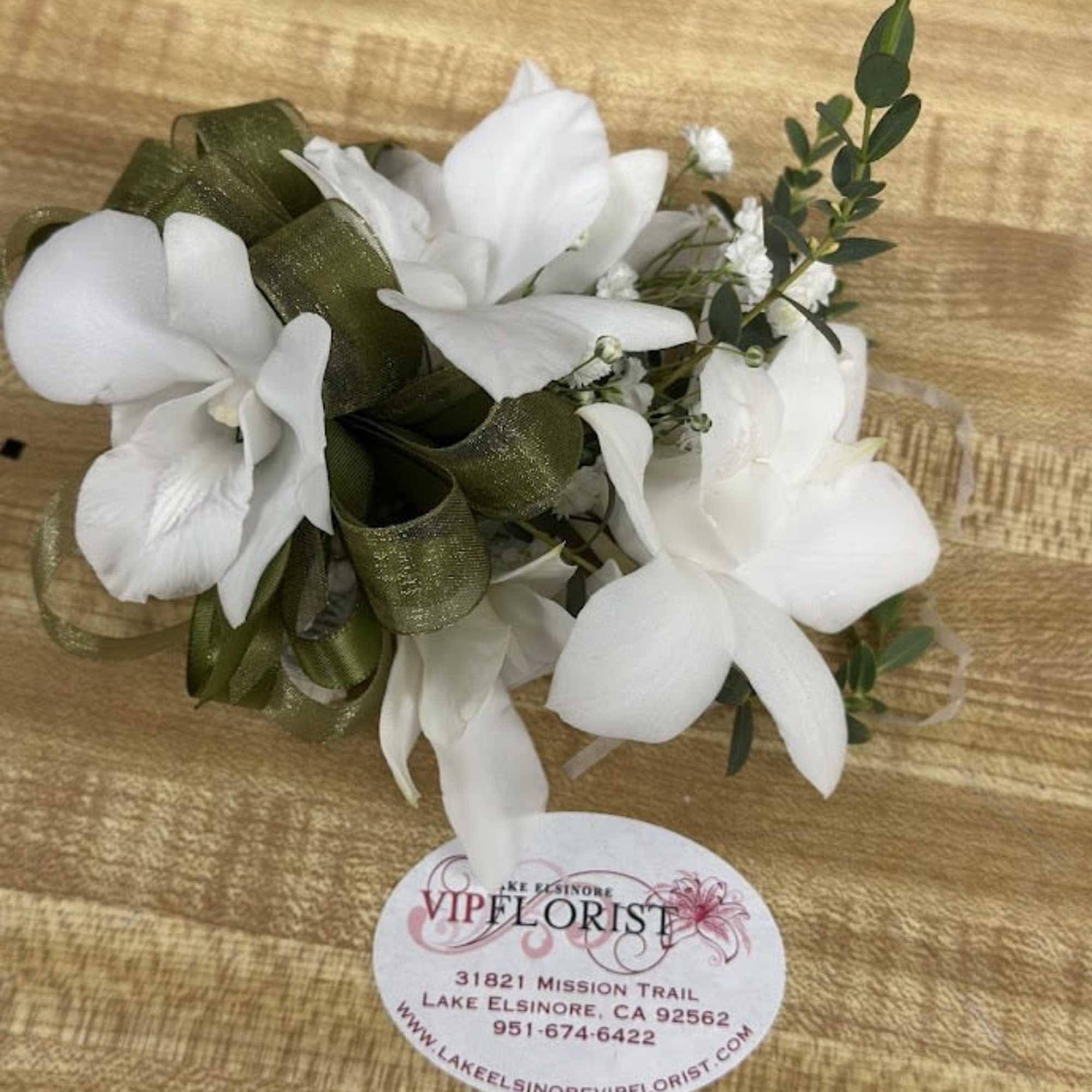 A delicate white rose corsage and matching boutonniere set that reads as, photo 3 of 4