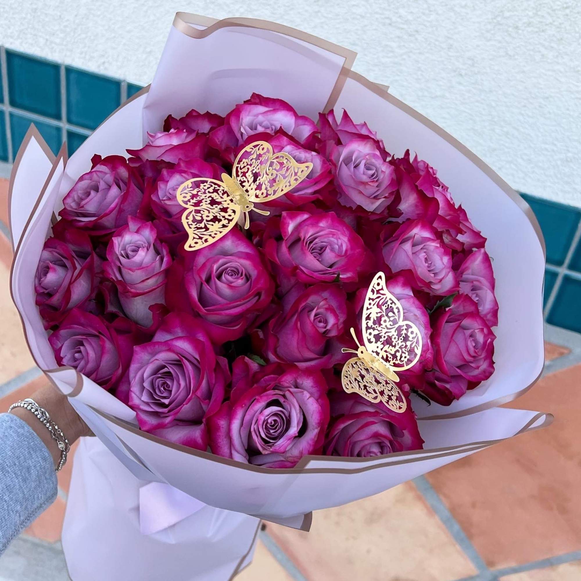 Wrapped roses bouquet is perfect to hand to someone on her birthday