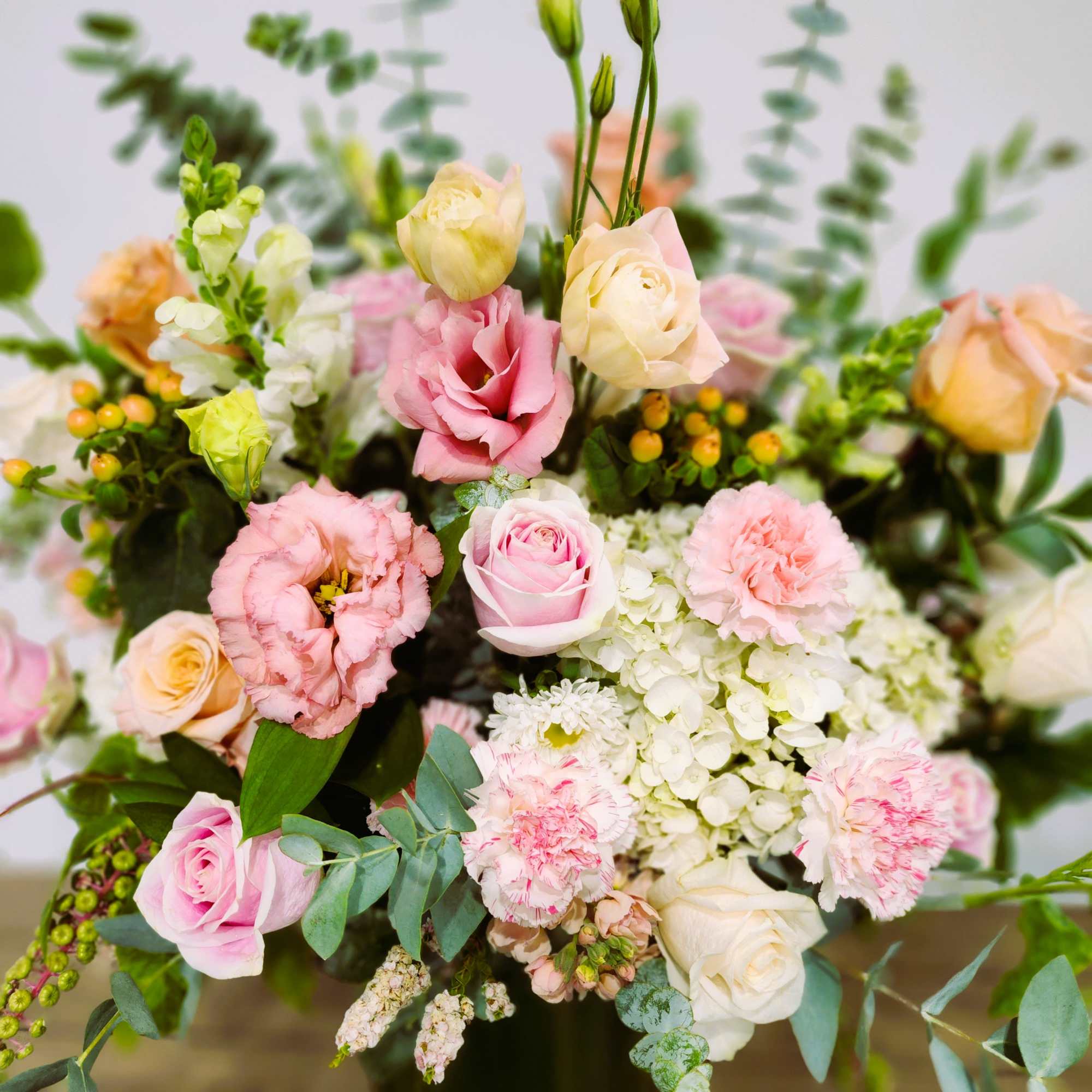 Pastel bouquet of roses, lisianthus, carnations, and hydrangea
