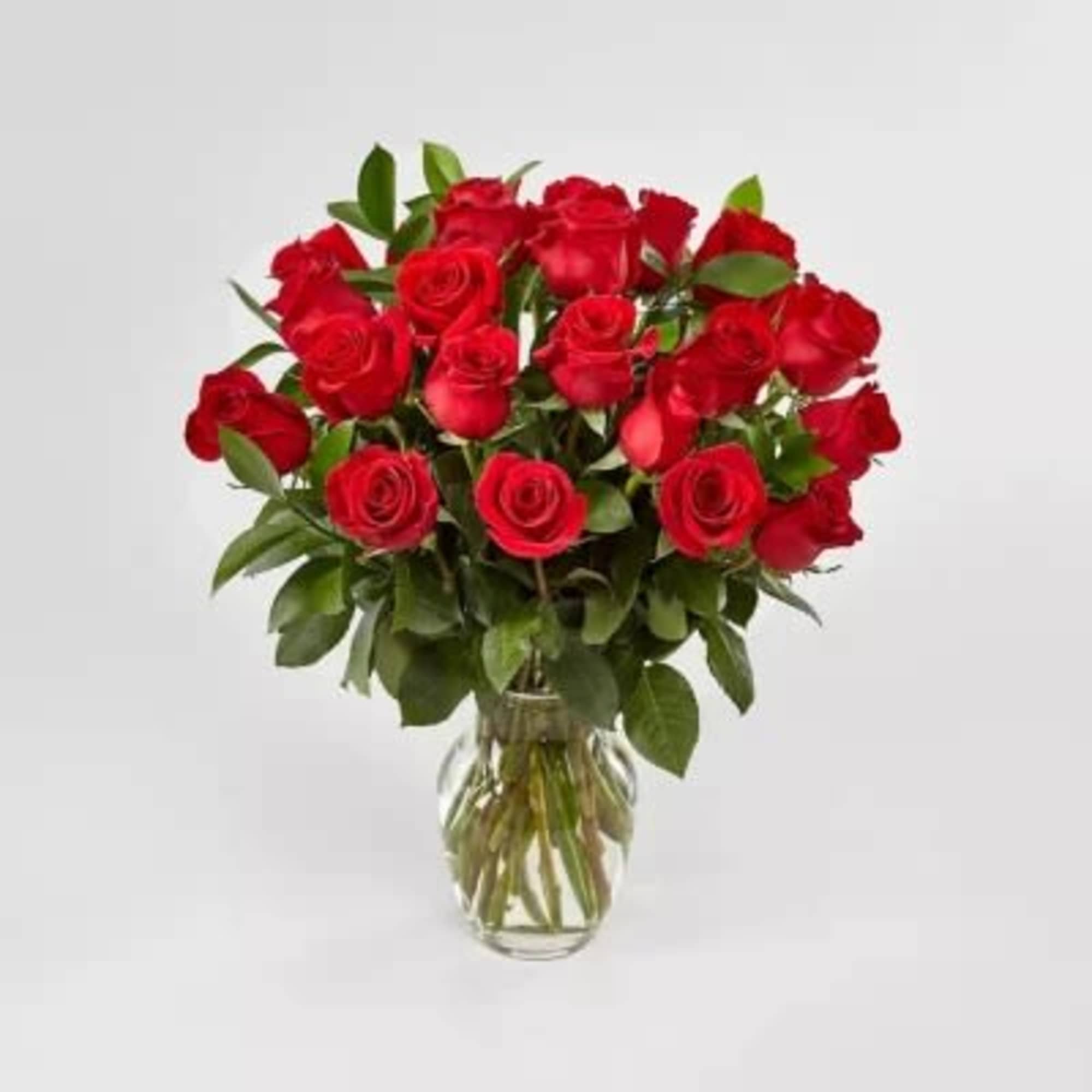 Bouquet of red roses in a clear glass vase