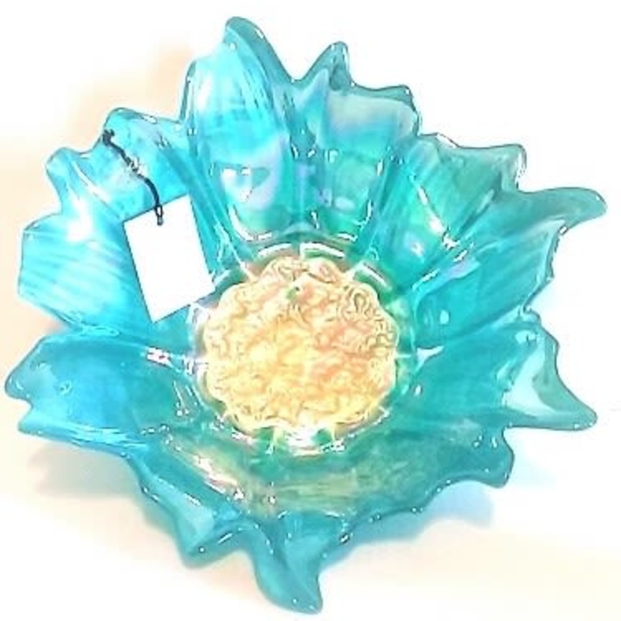Blue glass flower-shaped bowl with a pale textured center