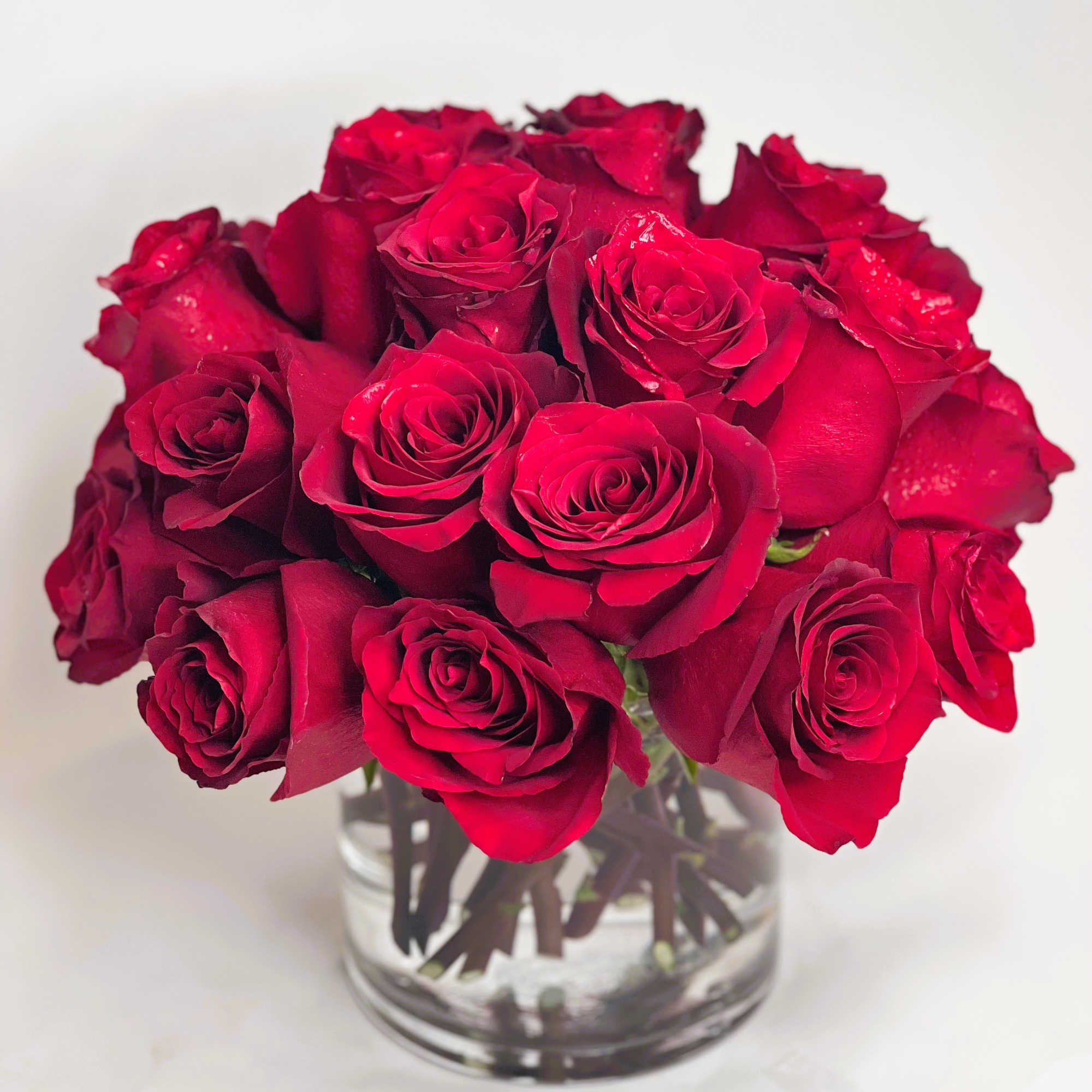 Bouquet of red roses in a clear glass vase