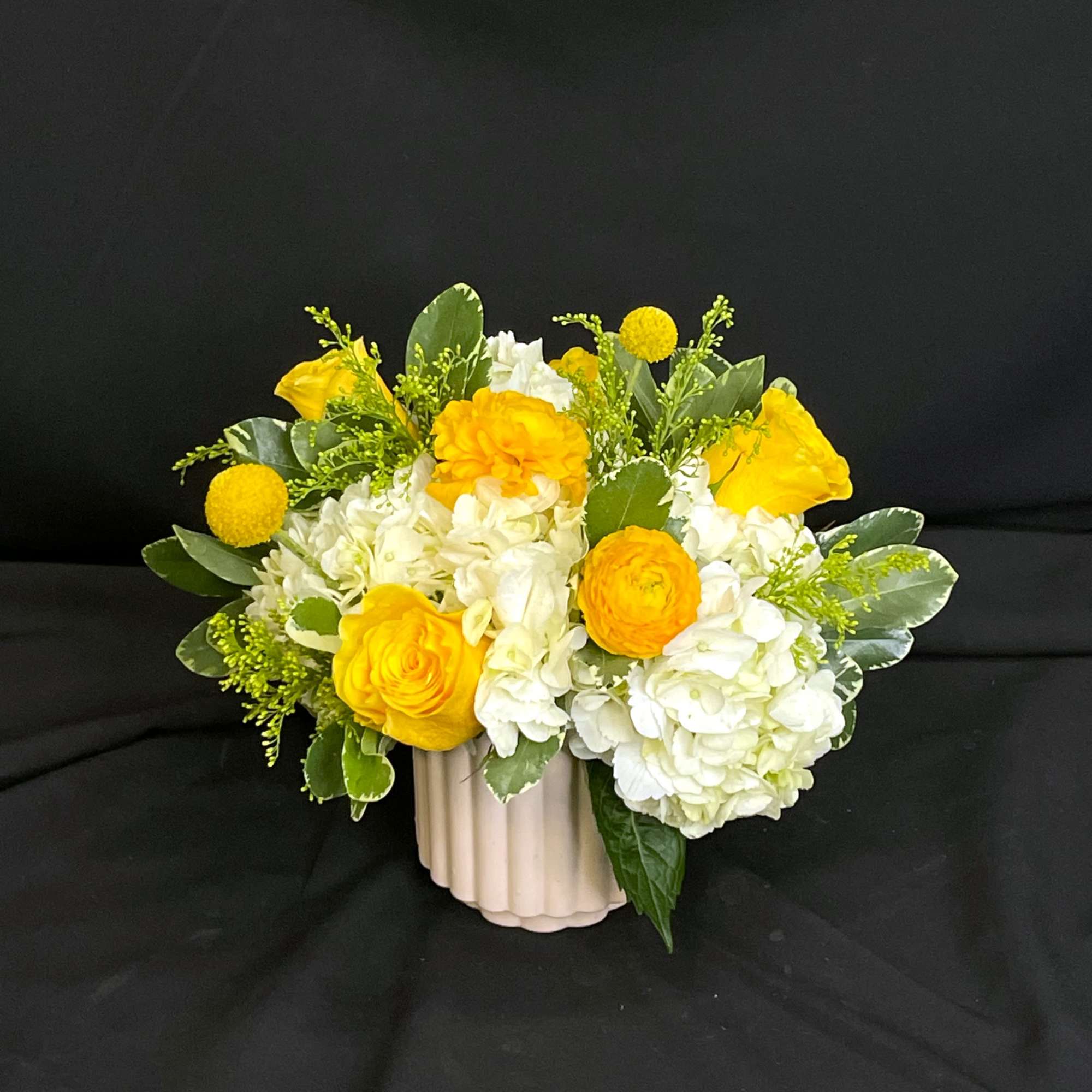 Sweet Madeline marries a cute pink ceramic vase with lovely yellow peach