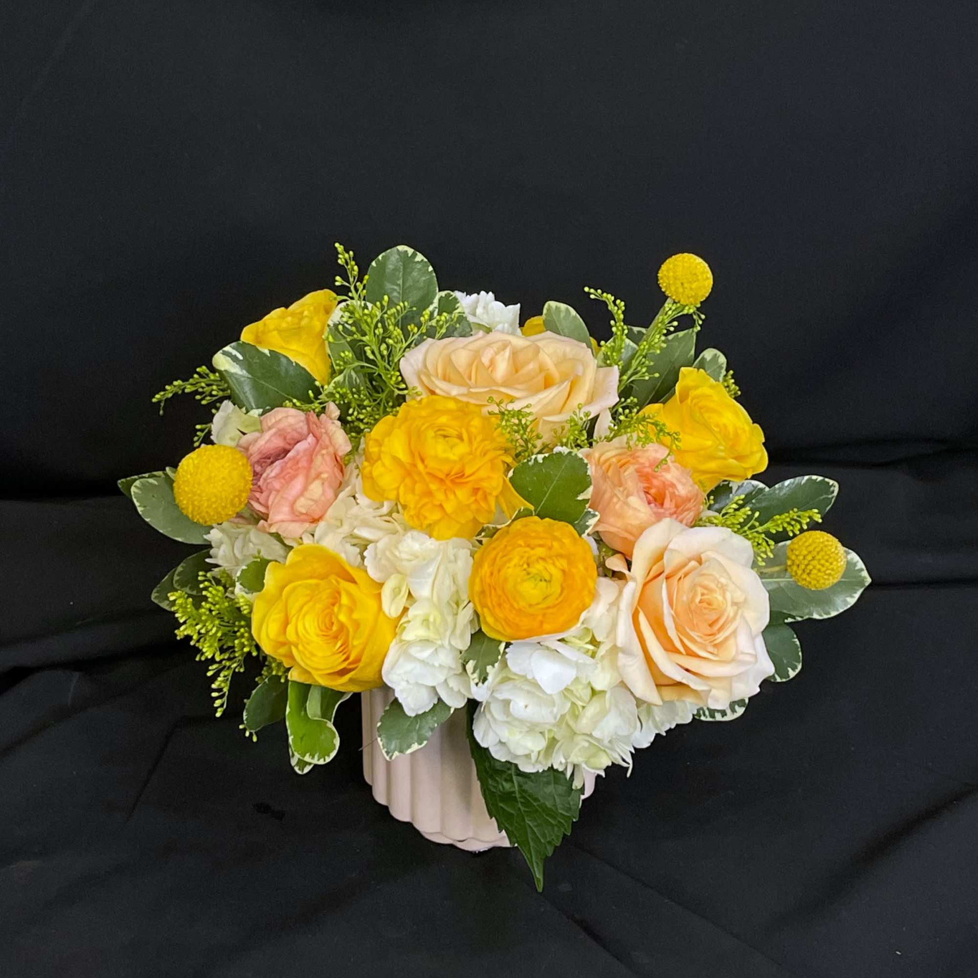 Sweet Madeline marries a cute pink ceramic vase with lovely yellow peach