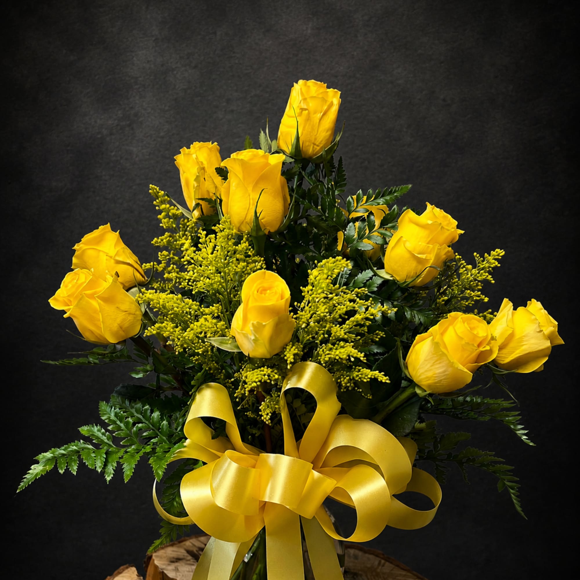 Bright clusters of yellow roses make an immediate sunny statement in this