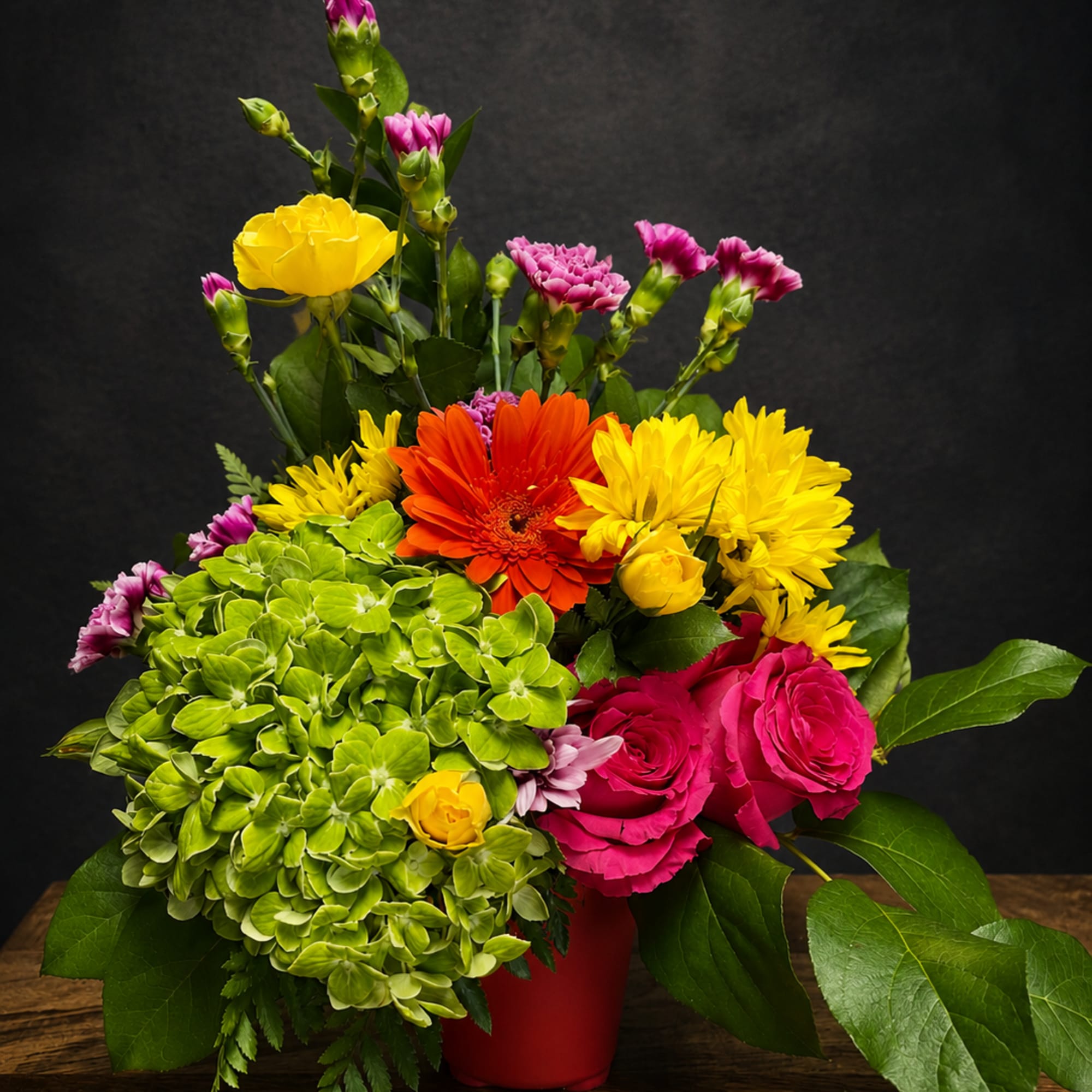 A burst of cheerful color anchored by a red vase - Sunshine