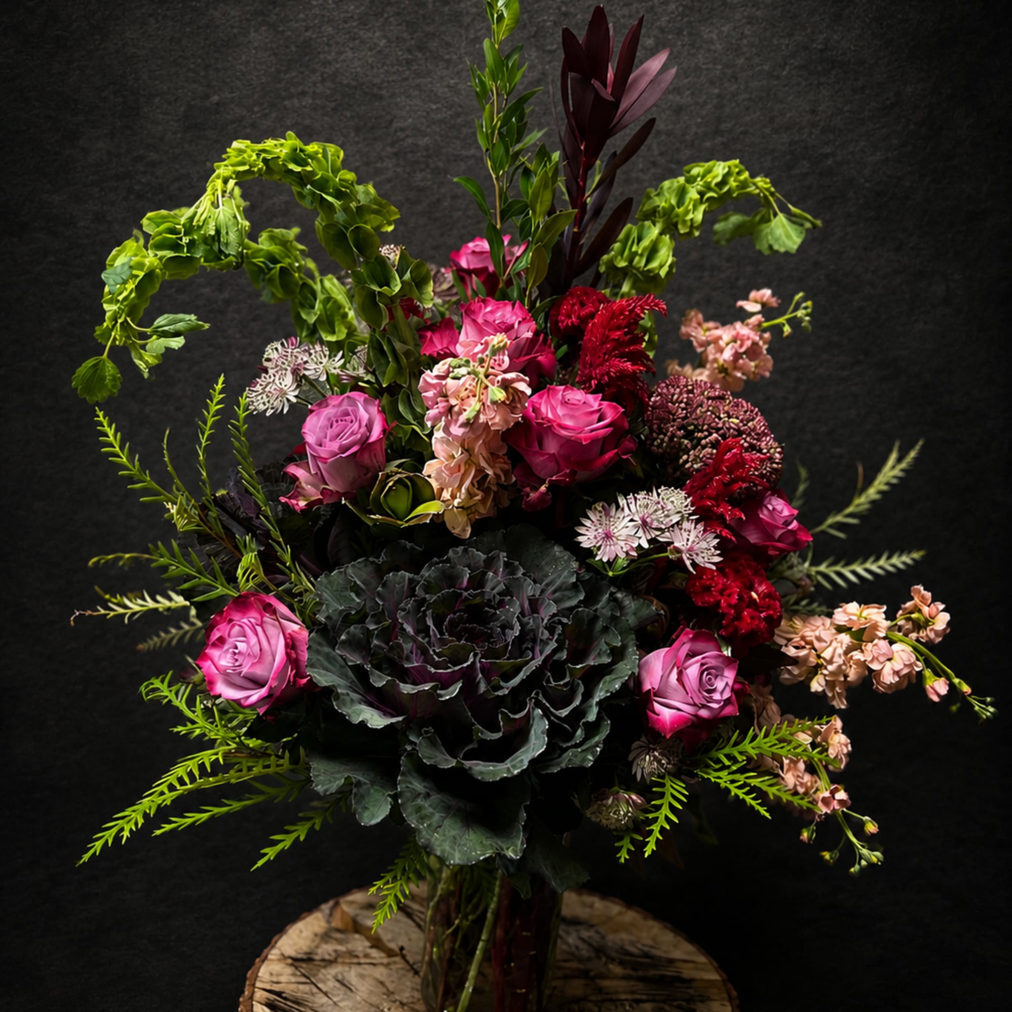 An arrangement with a modern twist of flowers intricately arranged for any