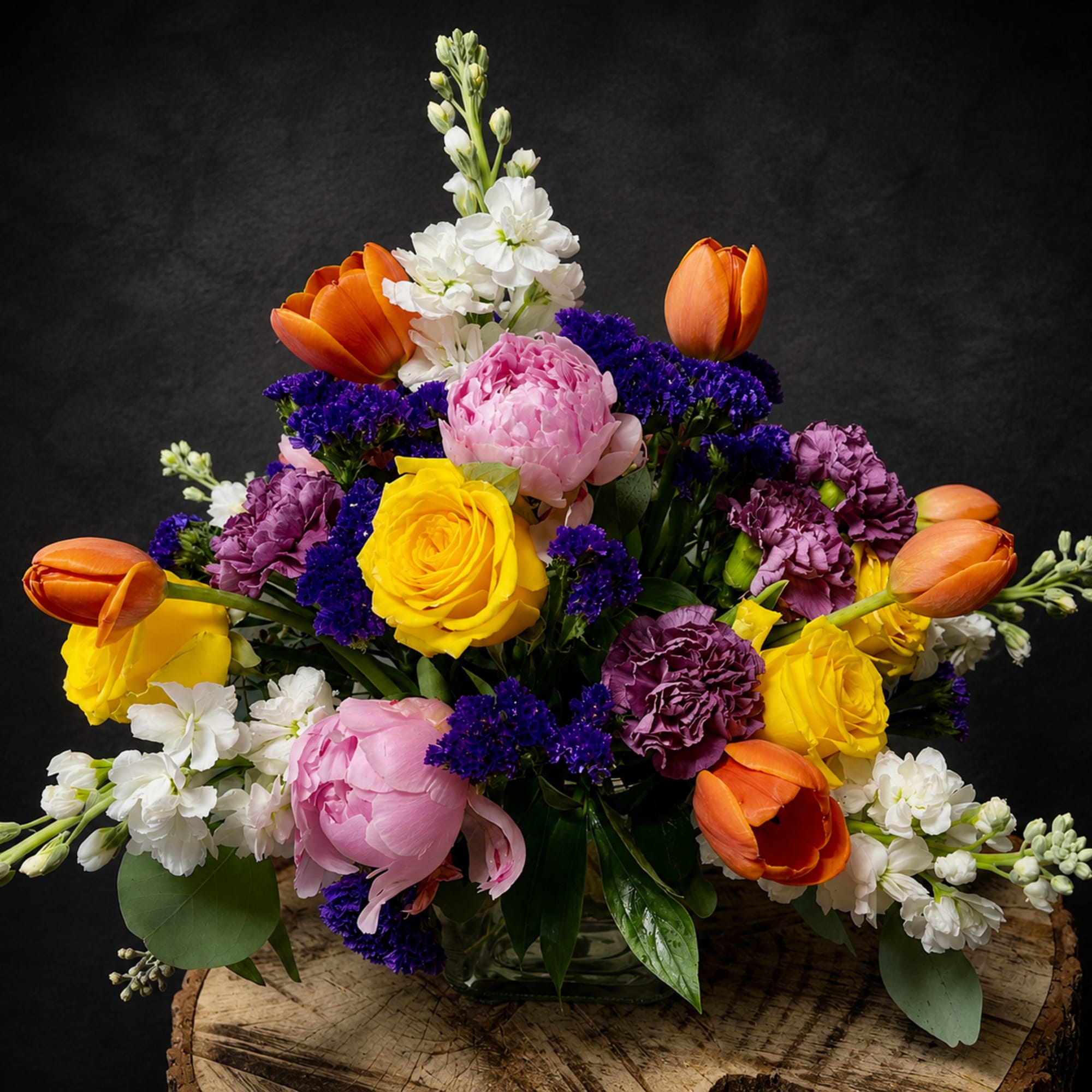 A radiant, garden-style flower arrangement that reads like a joyful celebration in
