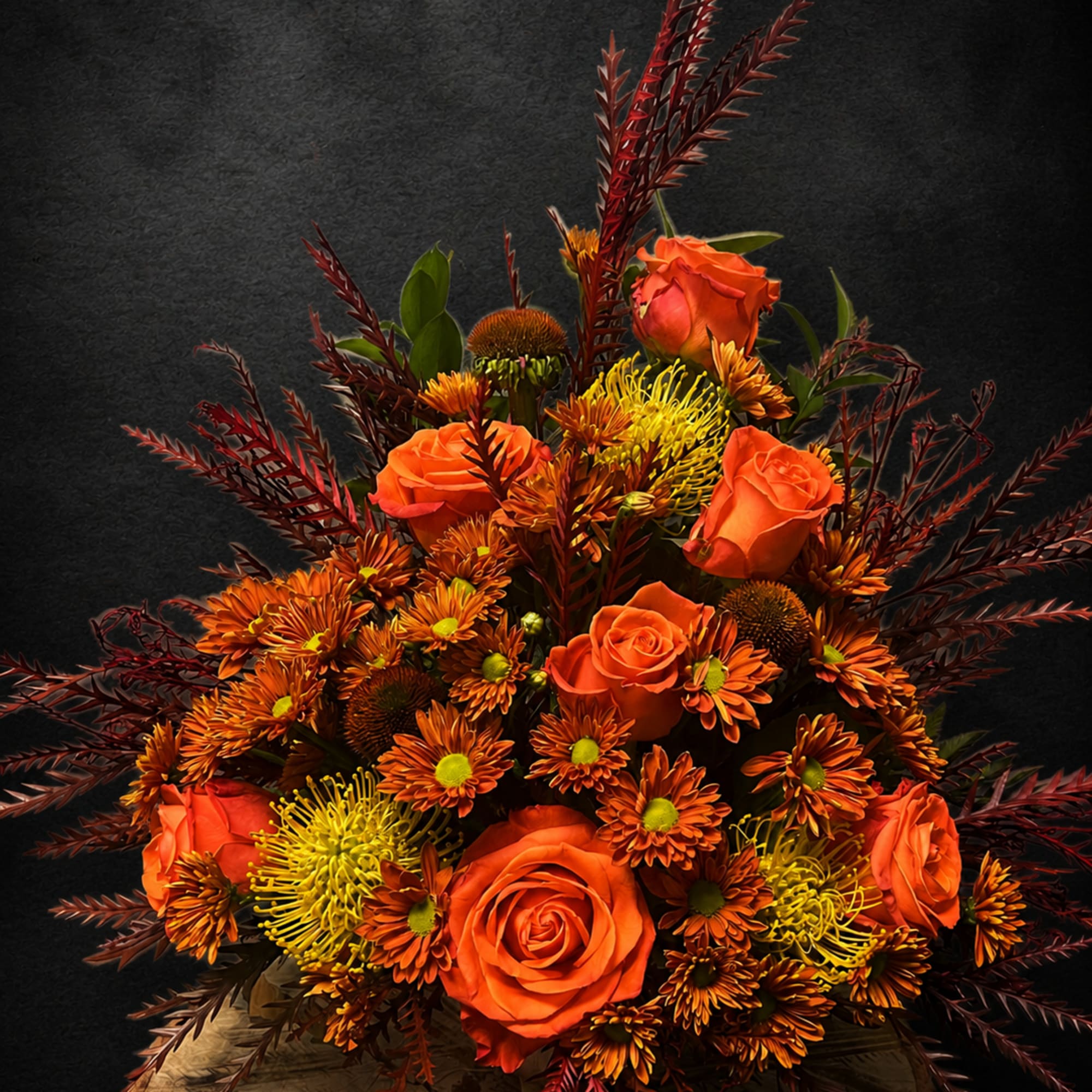 Bright, warm and full of autumnal texture, this fall flower arrangement is